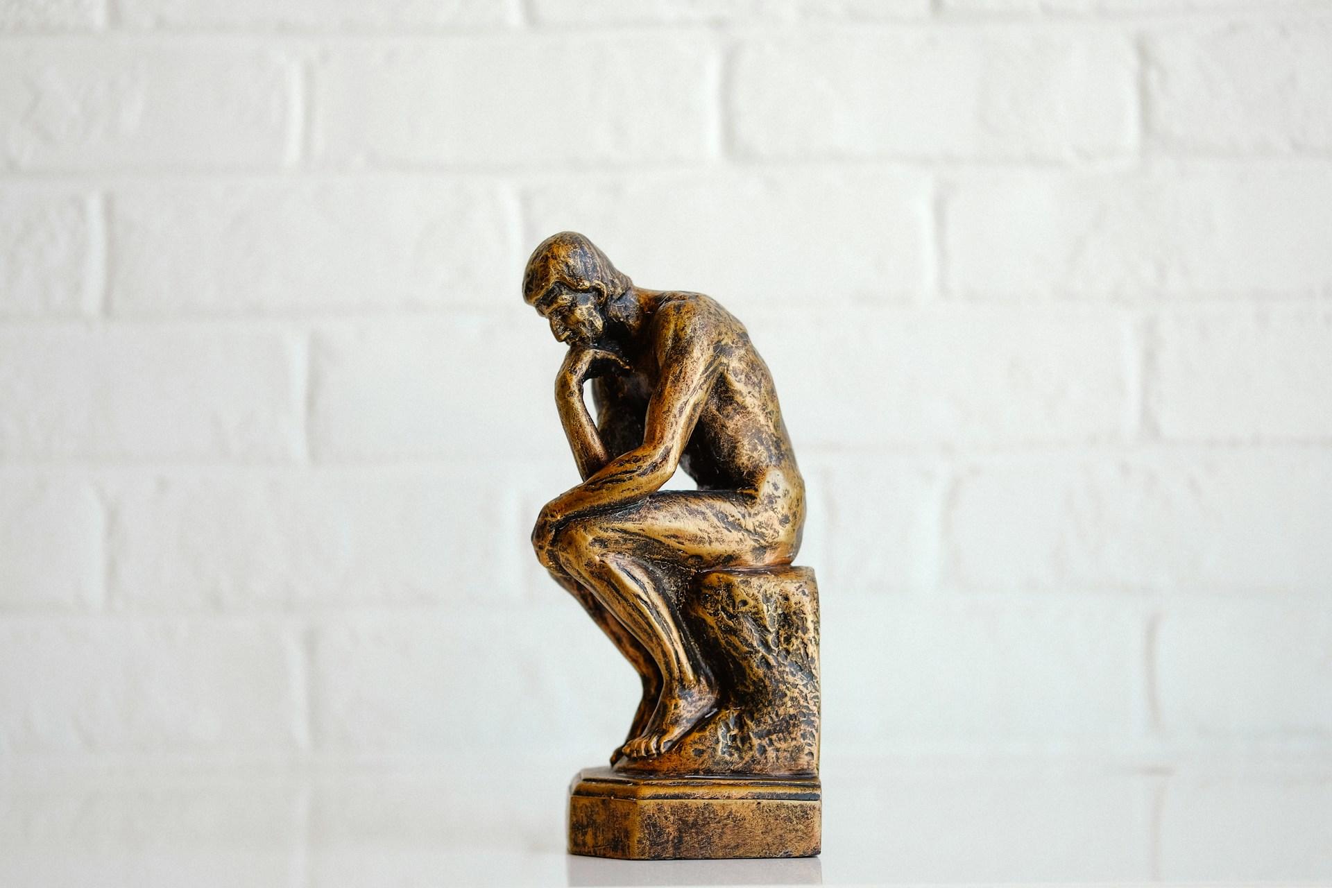 A bronze statue of the Thinker
