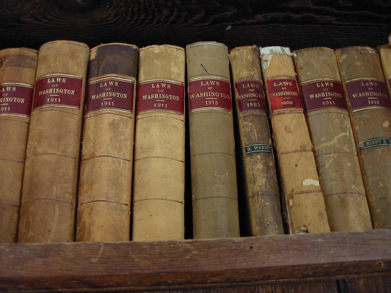A bookcase of archaic law books. 