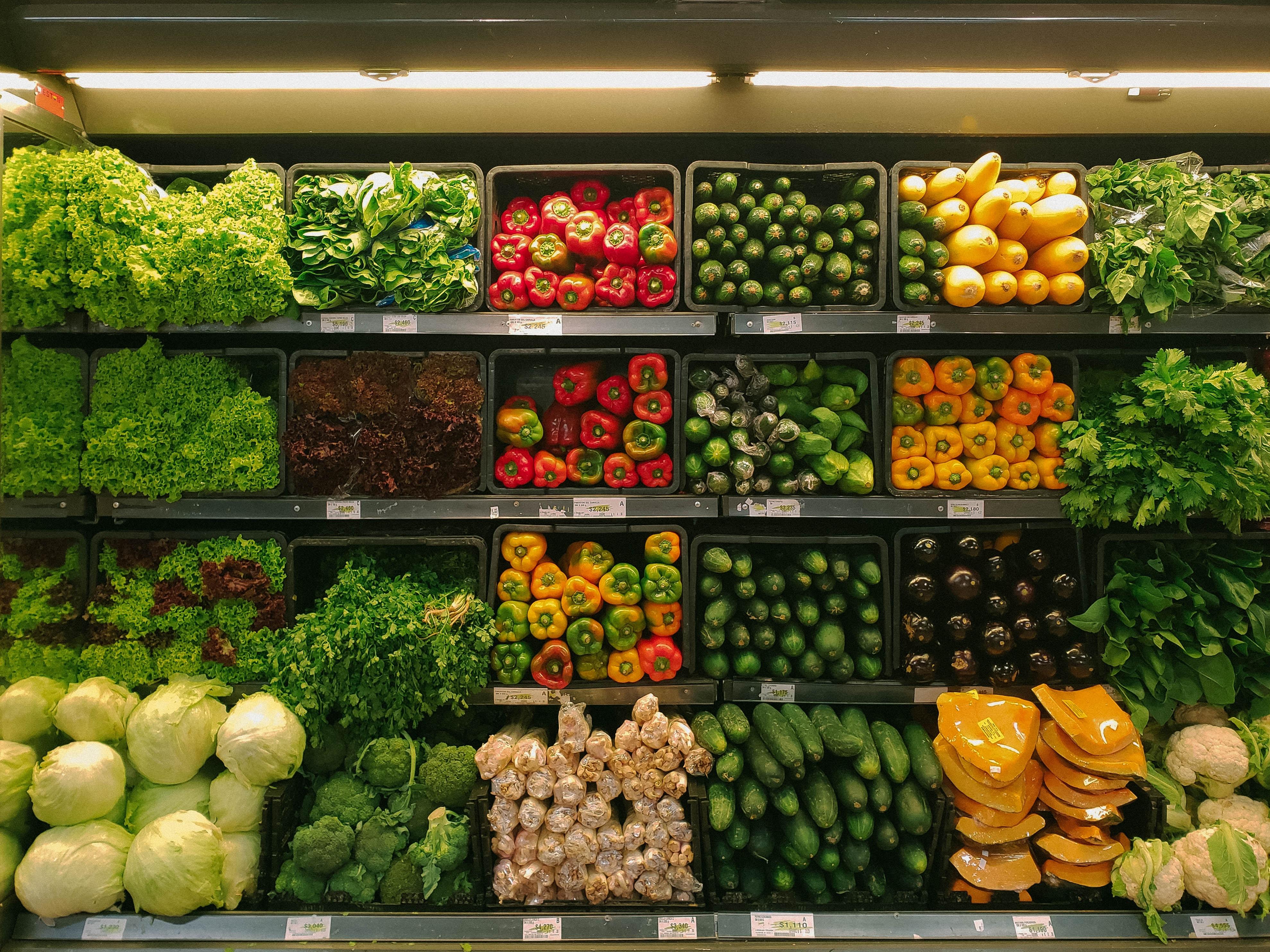 A grocery shelf full of fresh produce.