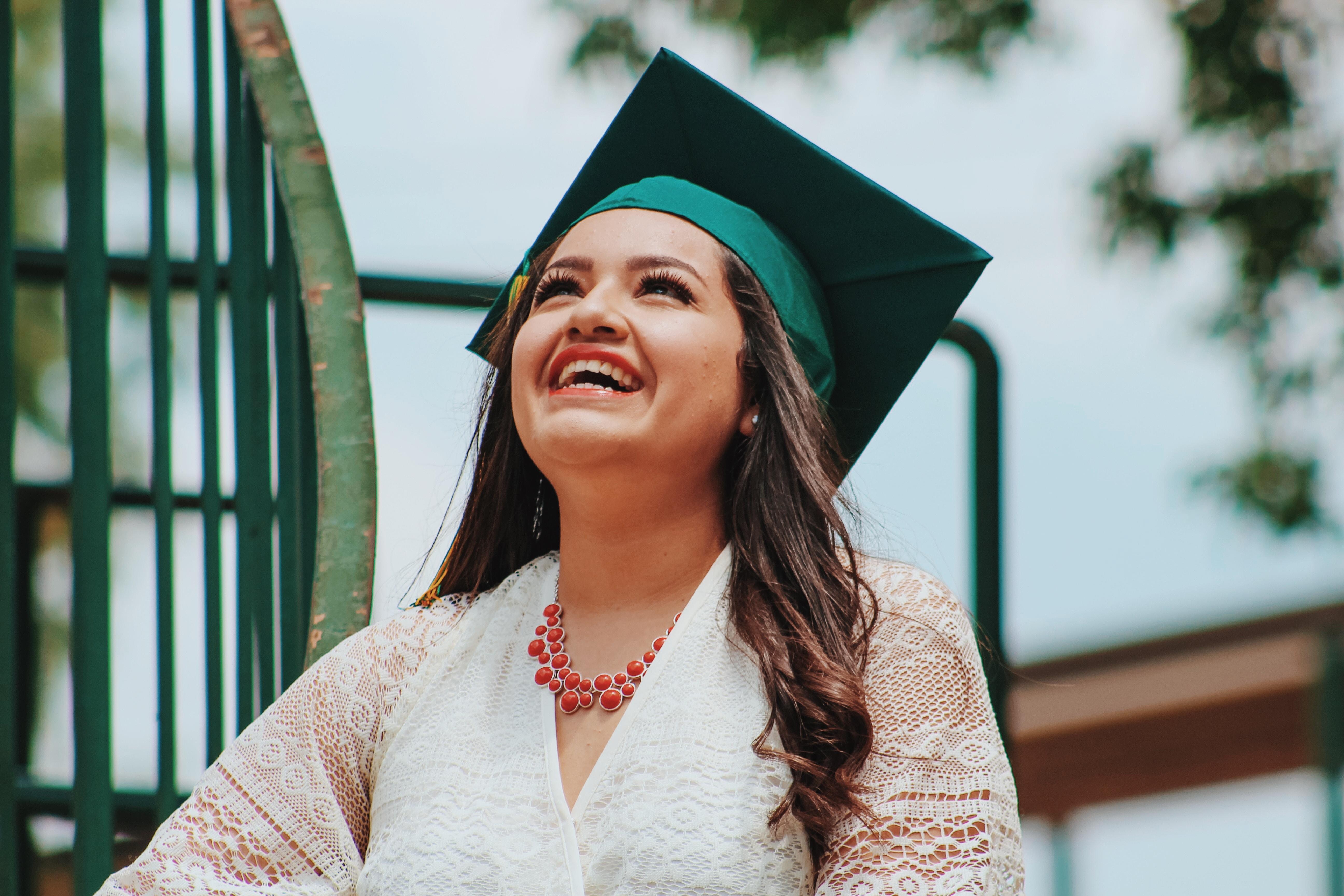 Girl smiling with graduation mortarboard. 