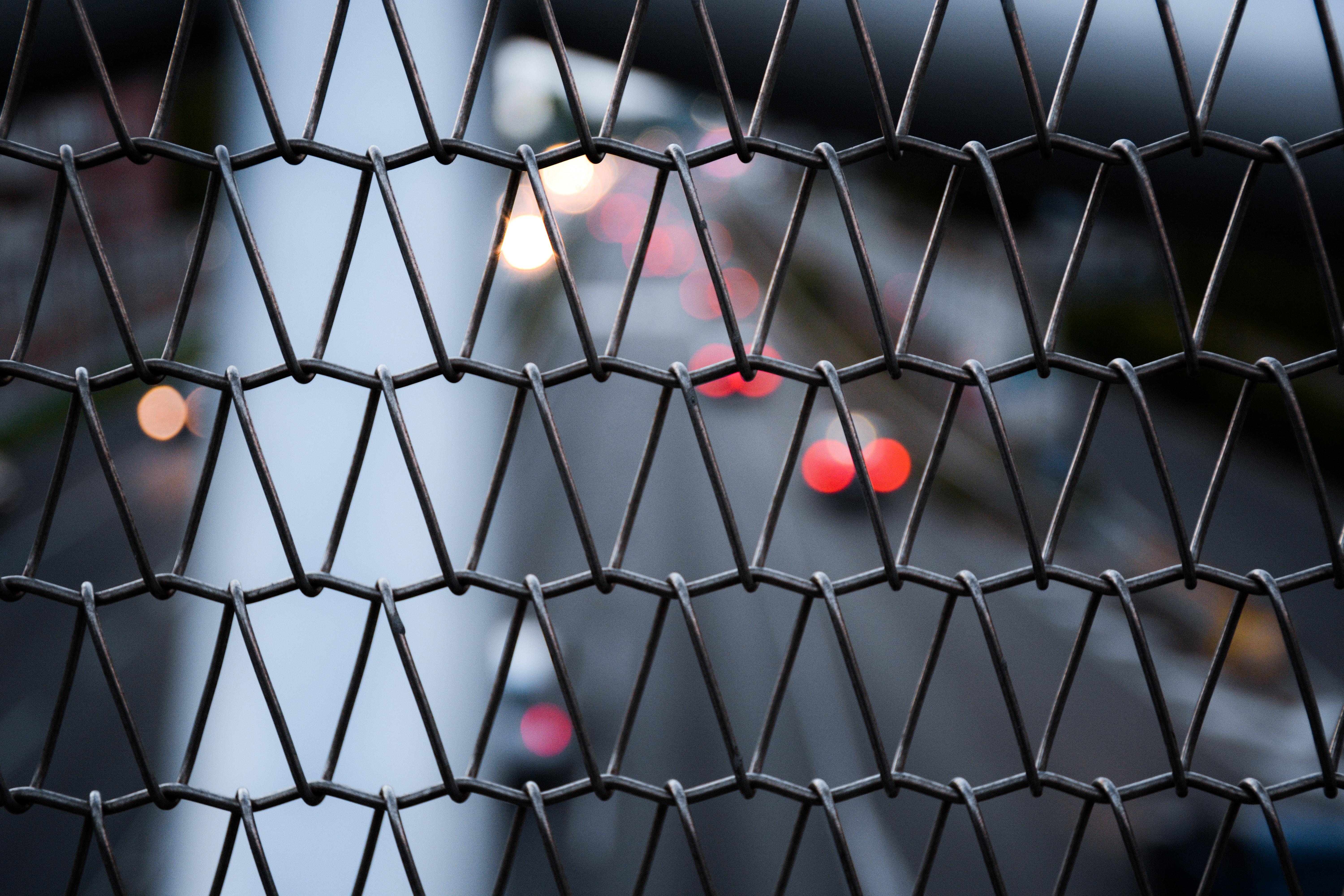 Gray wire fence macro photography