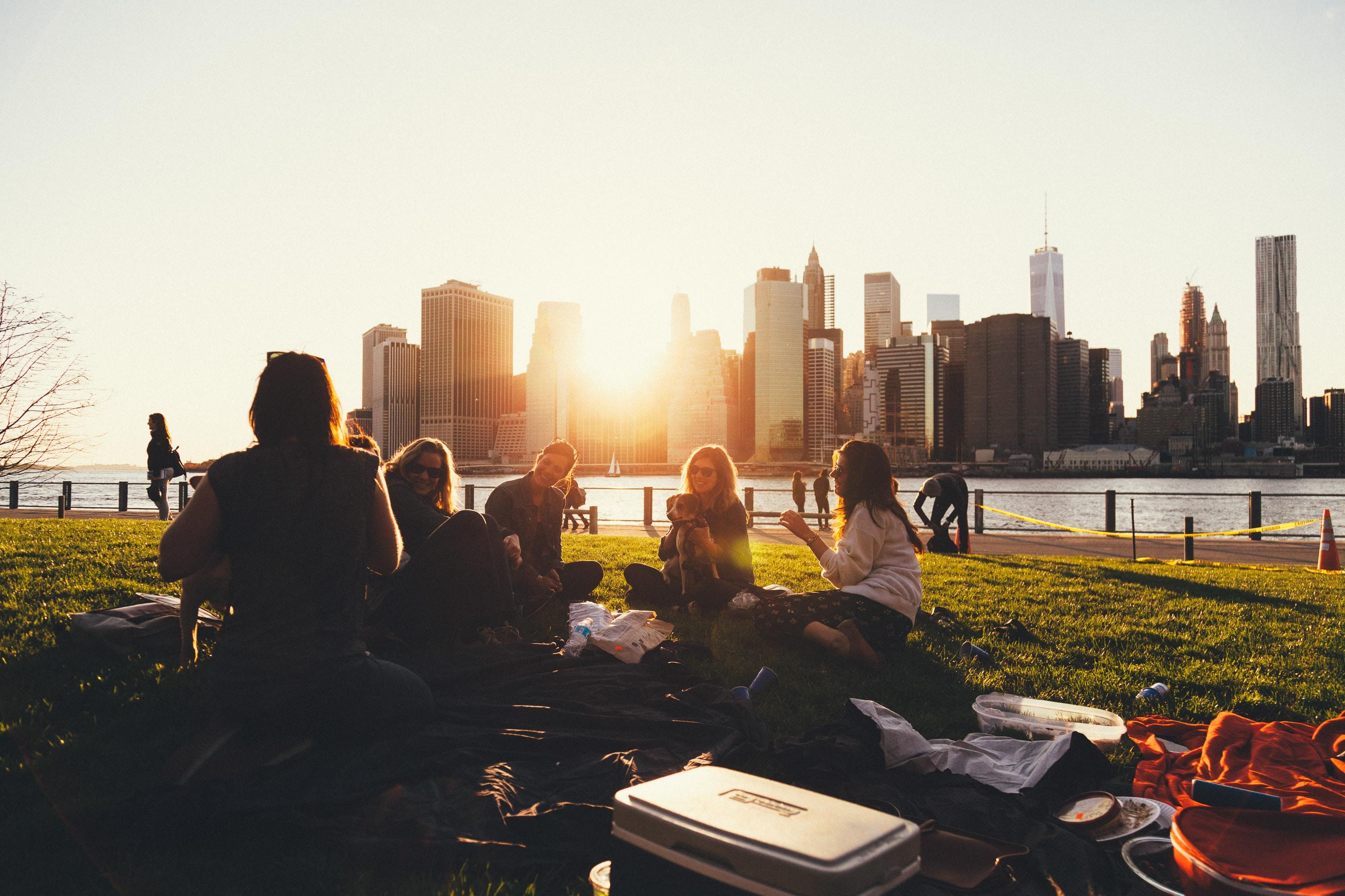 Group of people sitting on grass