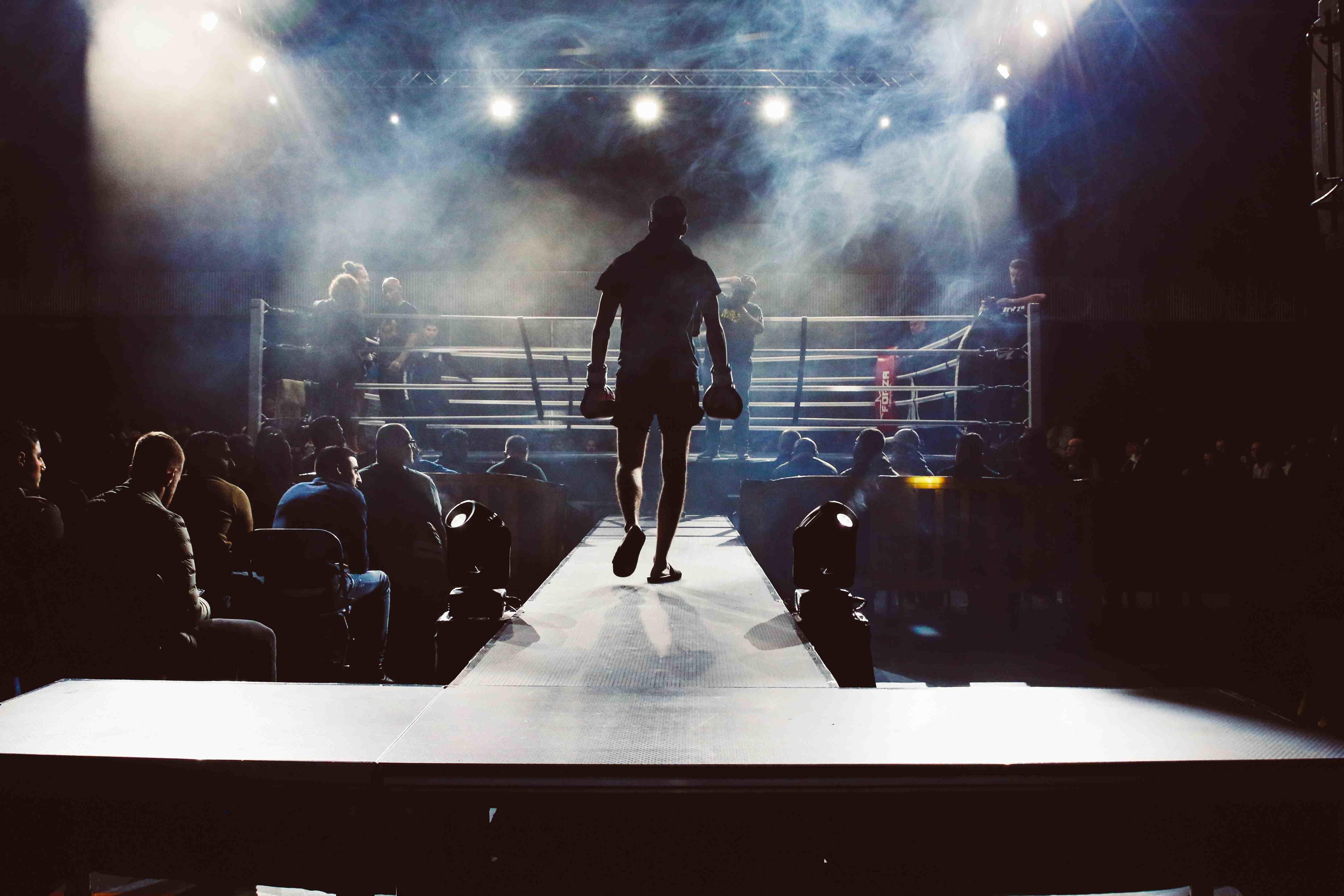 Boxer walking towards a boxing ring