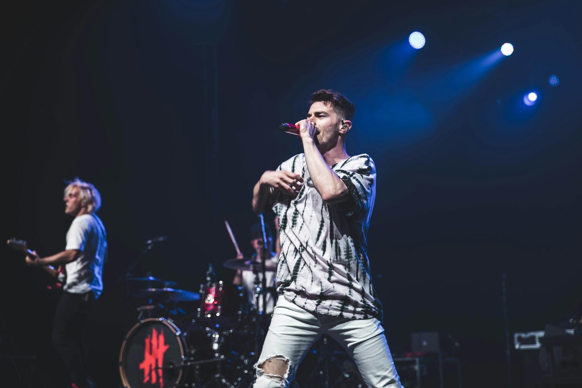 A singer performing on stage.