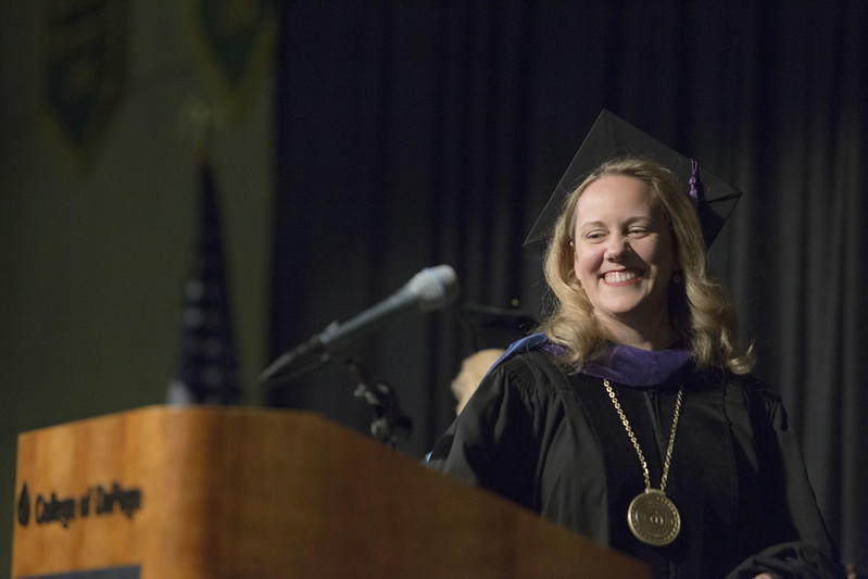 A graduate collects her degree certificate.