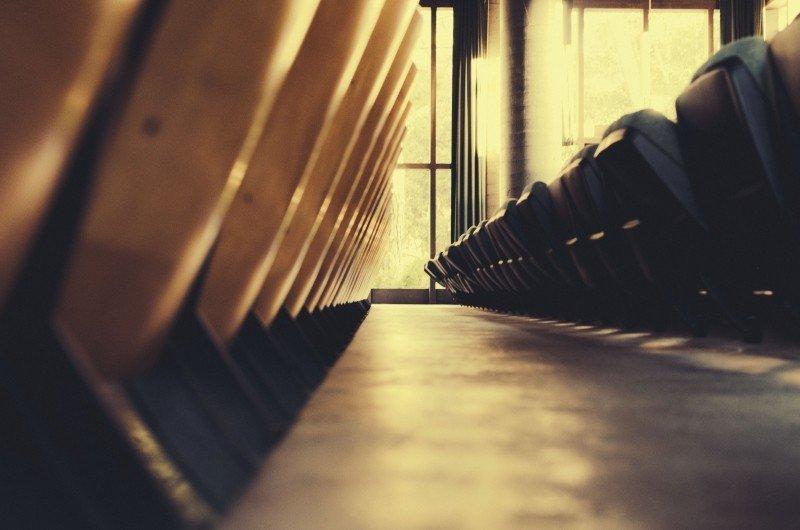 A row of chairs in a classroom.