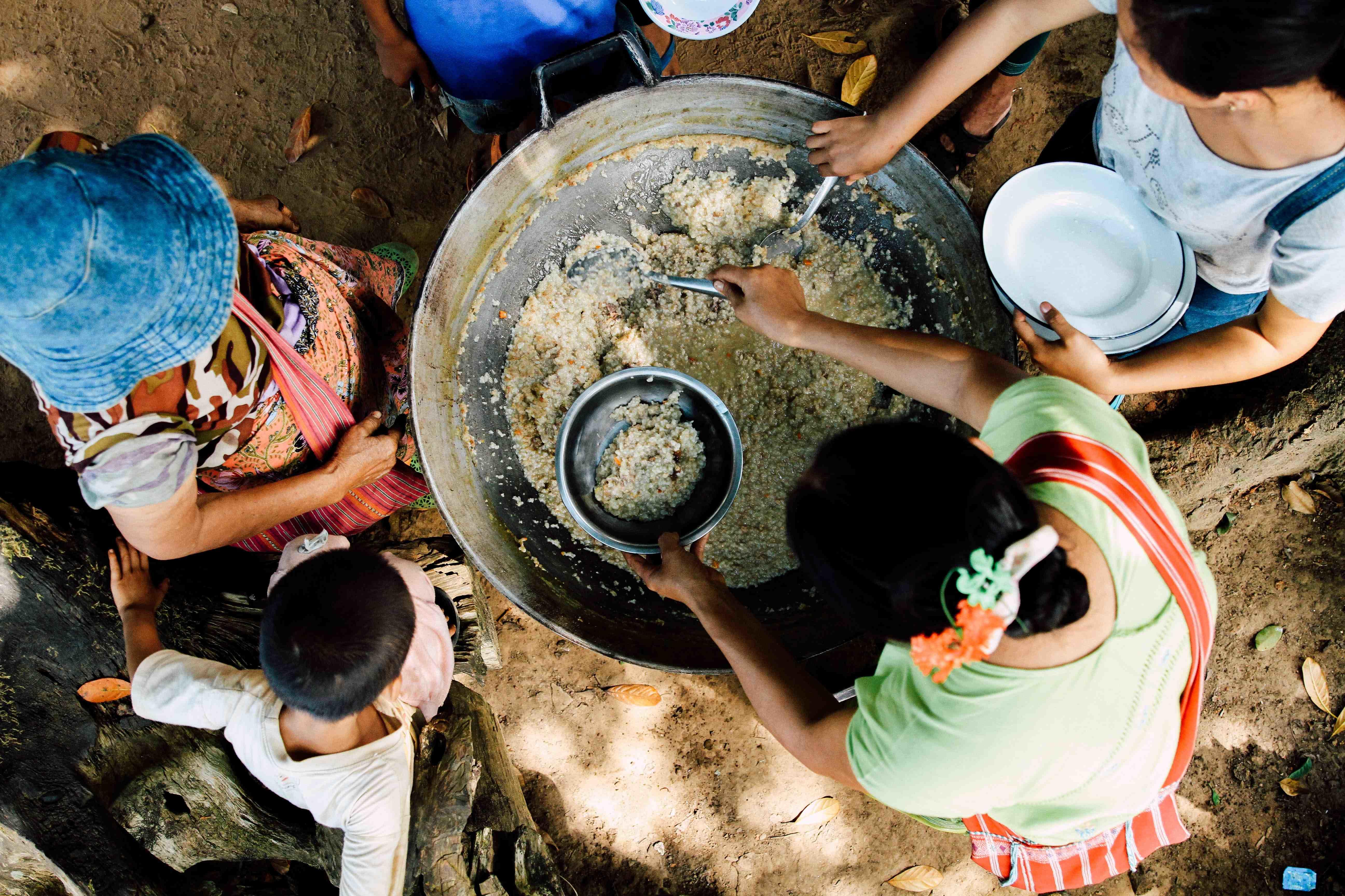 group of people cooking outdoors