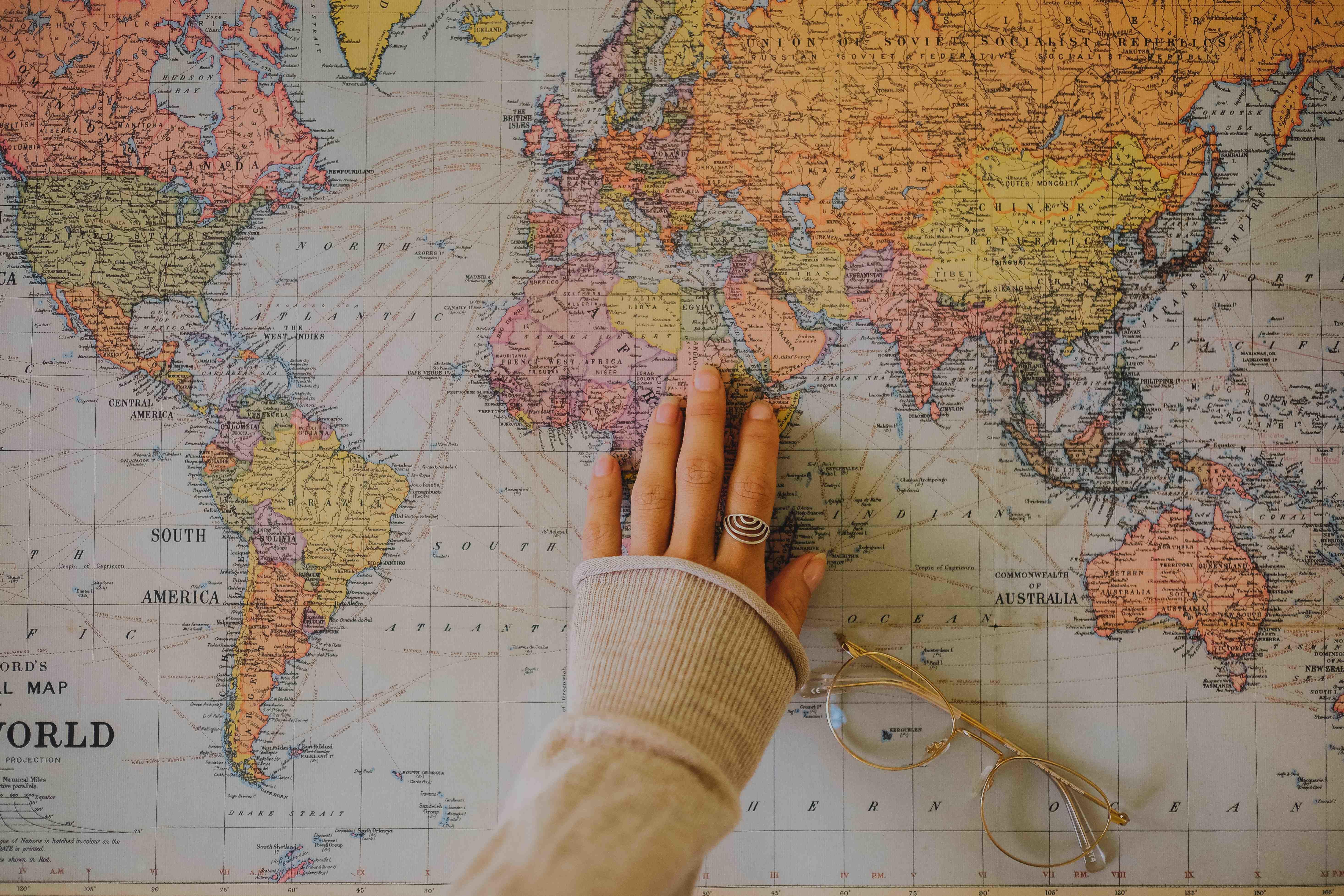 woman touching a map of the world