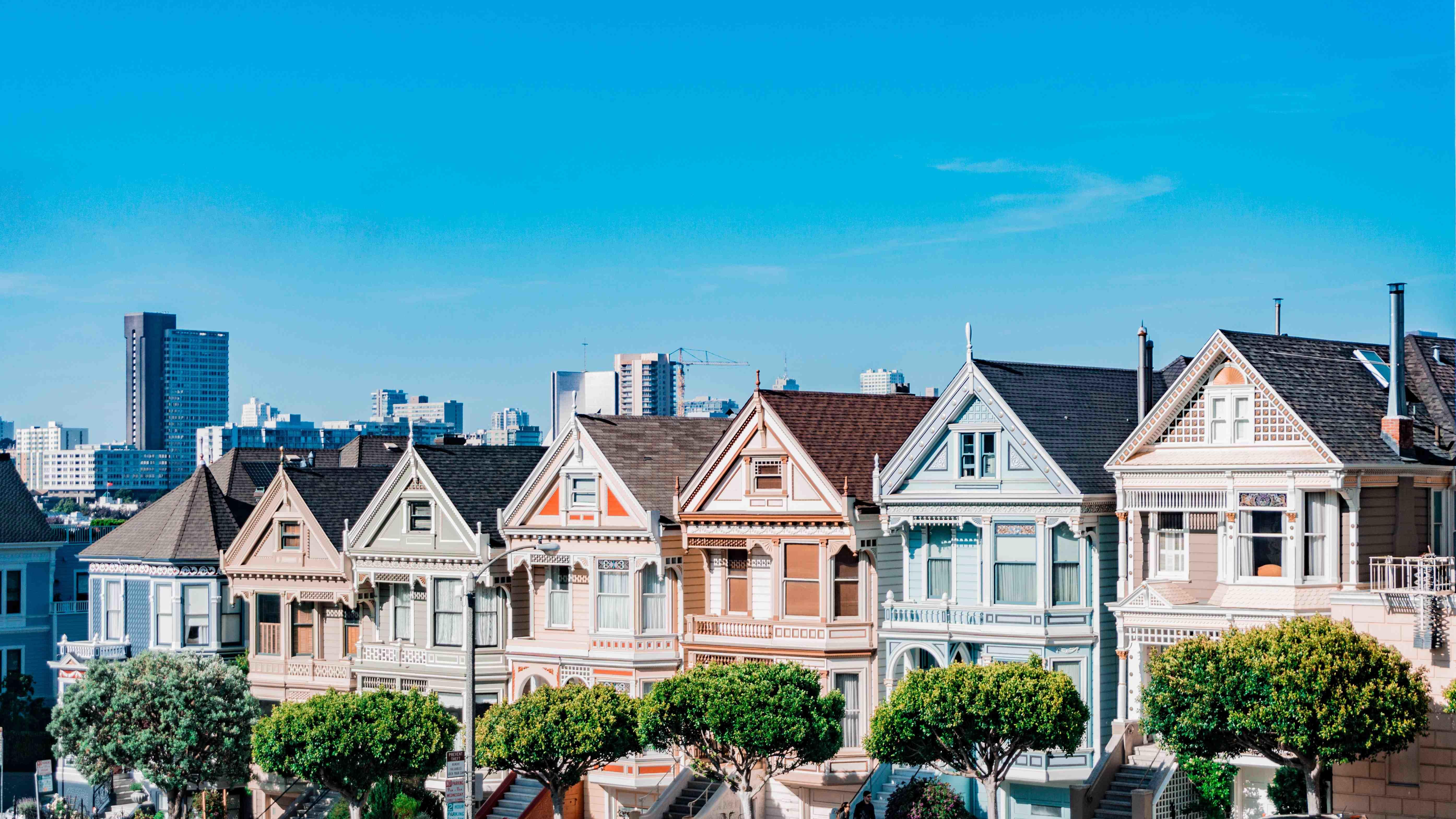 Painted Ladies in San Francisco shown with the city skyline in the background