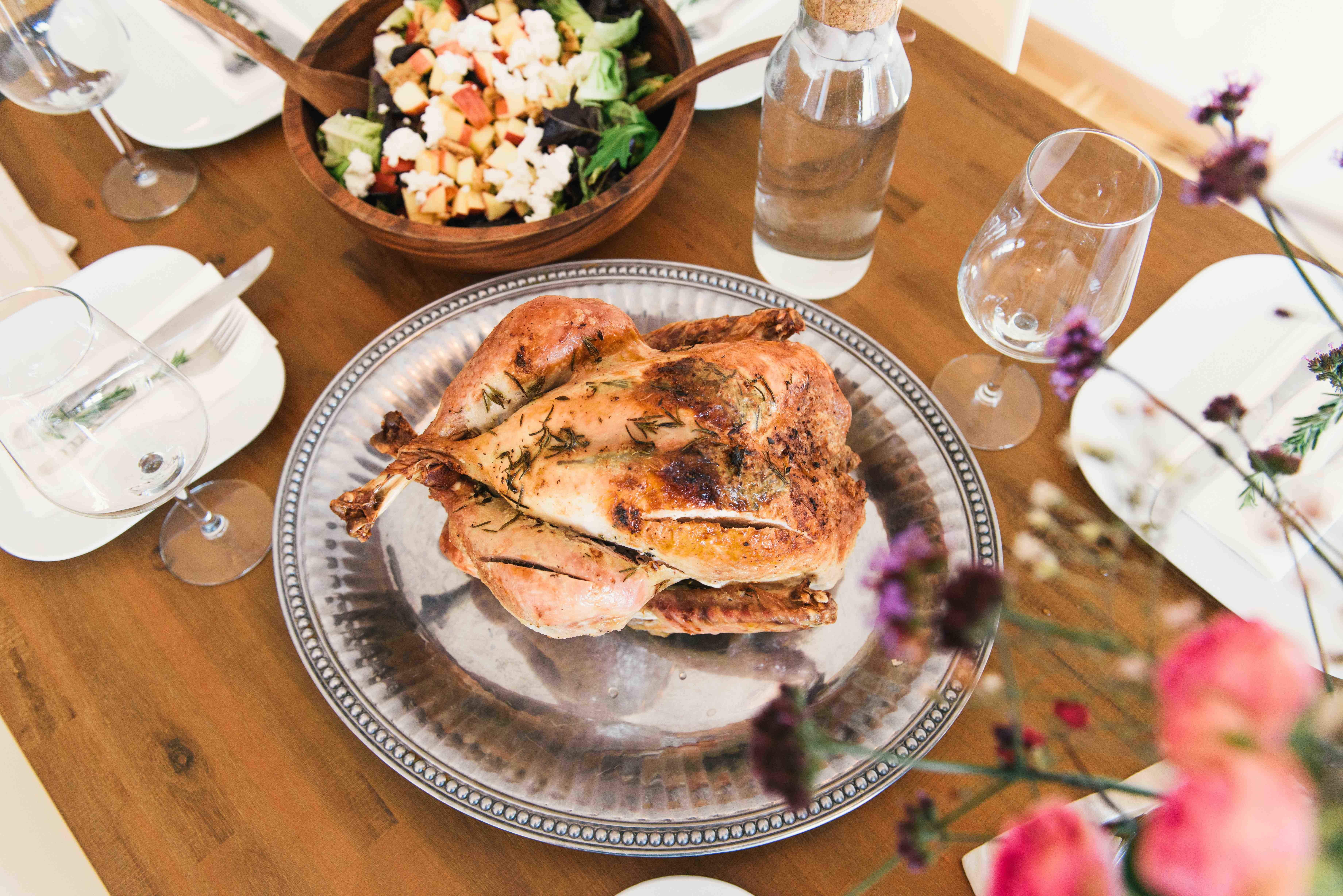 A whole roasted chicken served on a table