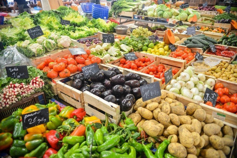 Fresh vegetables in wooden crates at a market