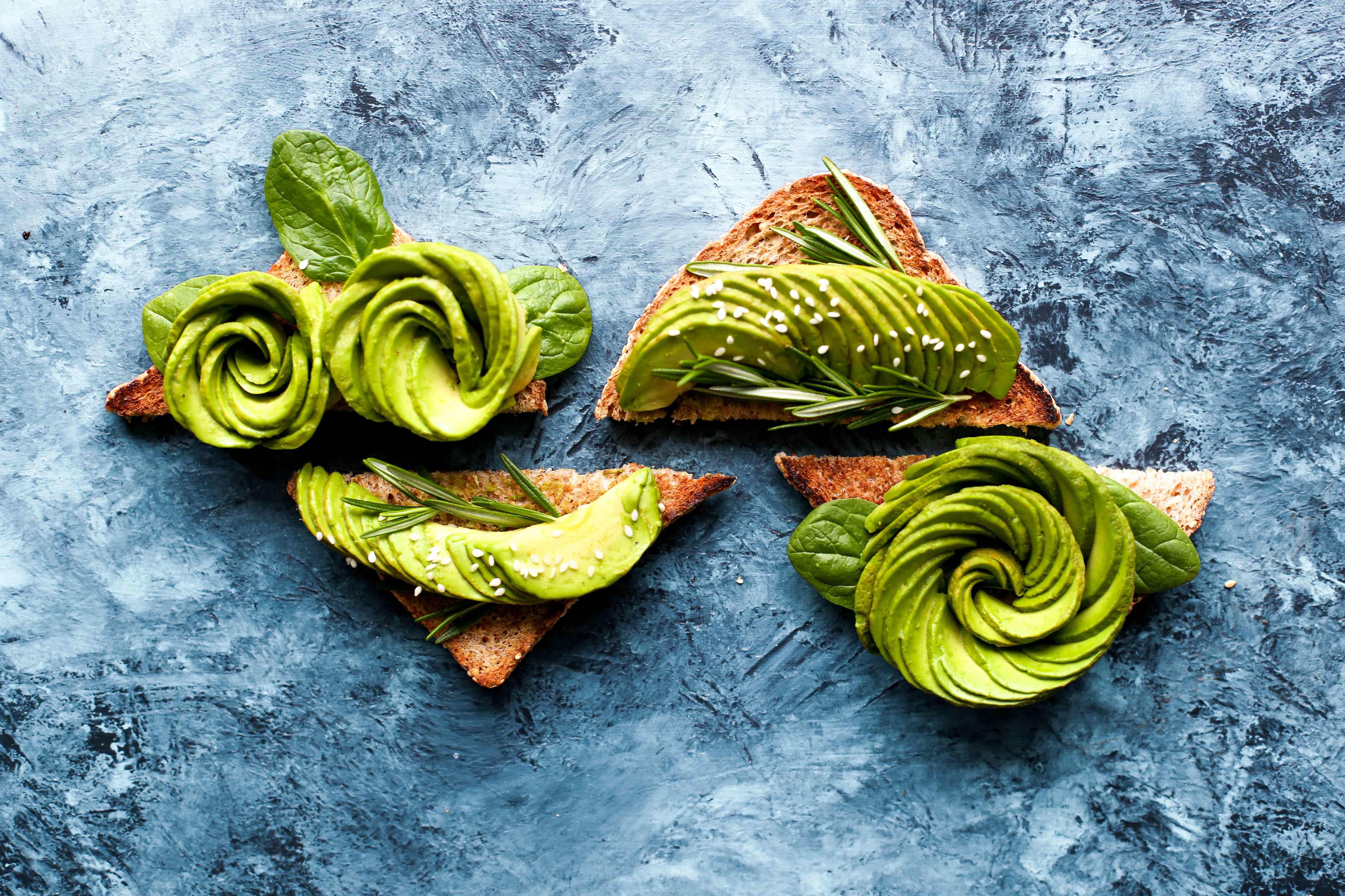 fancy avocado toasts in different shapes