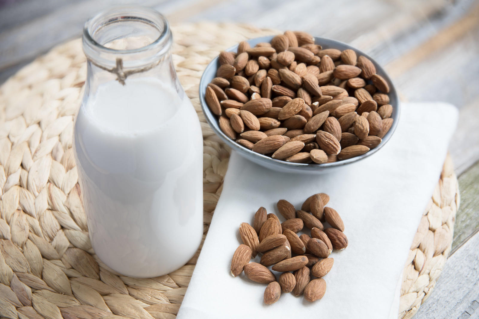 raw almonds and non dairy almond milk being shown