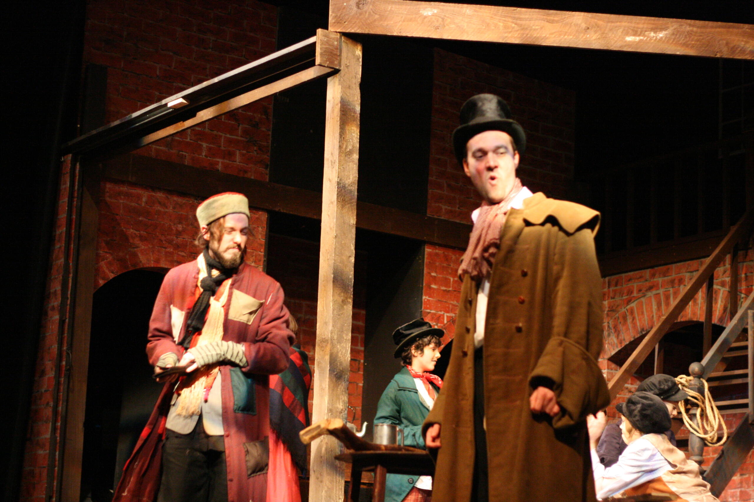 Two men during an acting scene for the musical Oliver Twist.