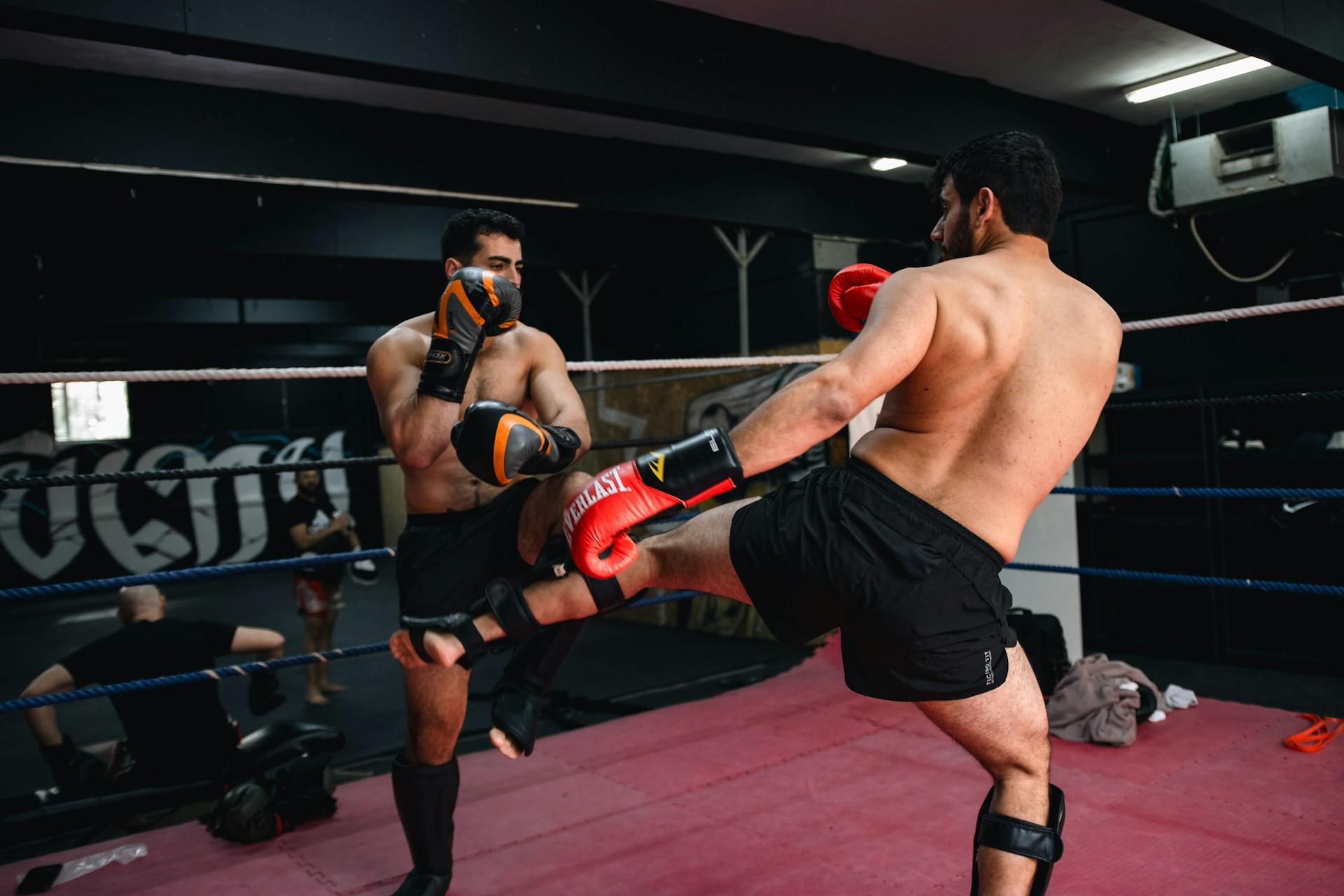 Two boys boxing in a ring