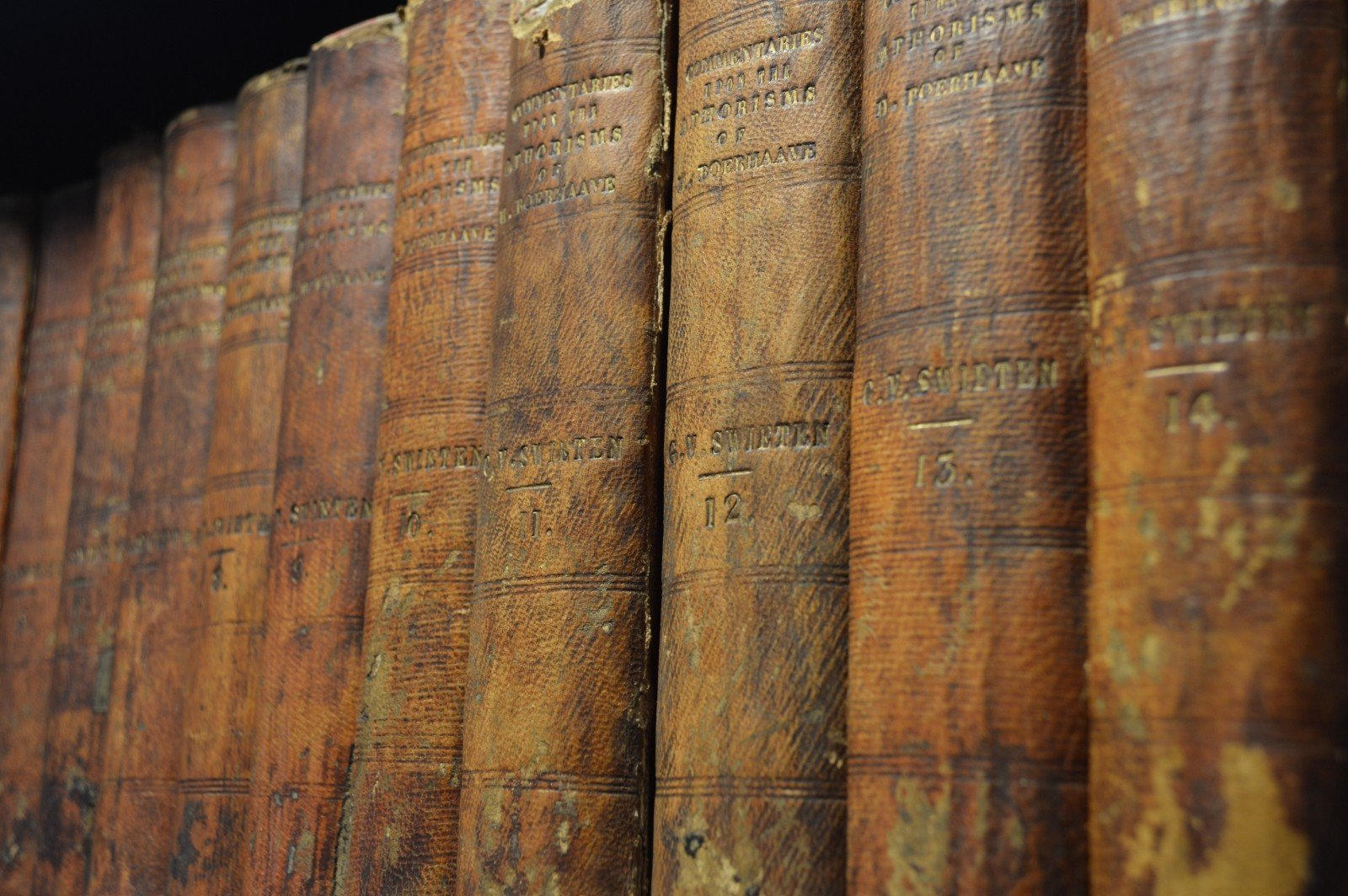 close up of very old books most likely in a library 