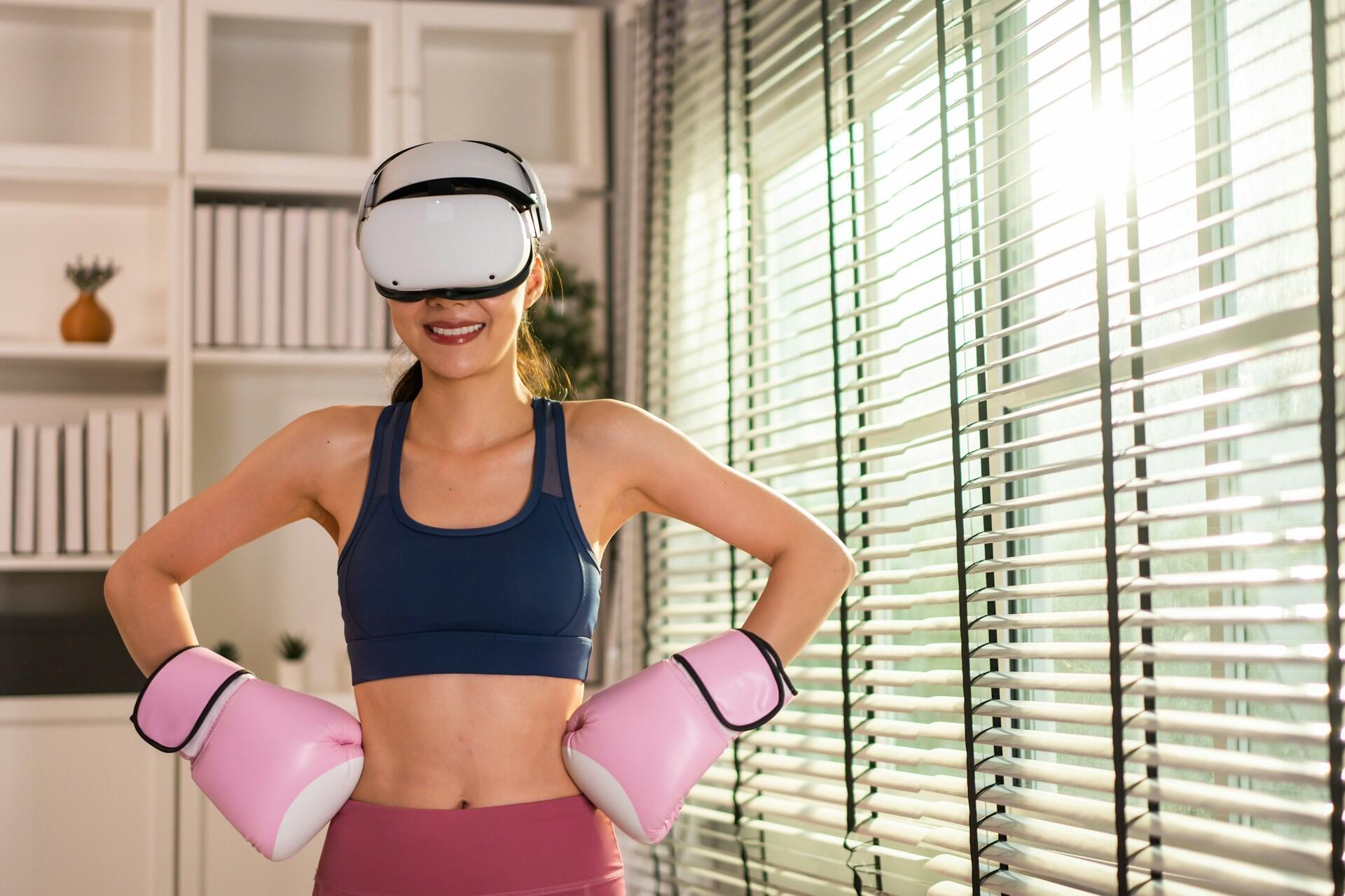 A girl boxing at home with a VR set.