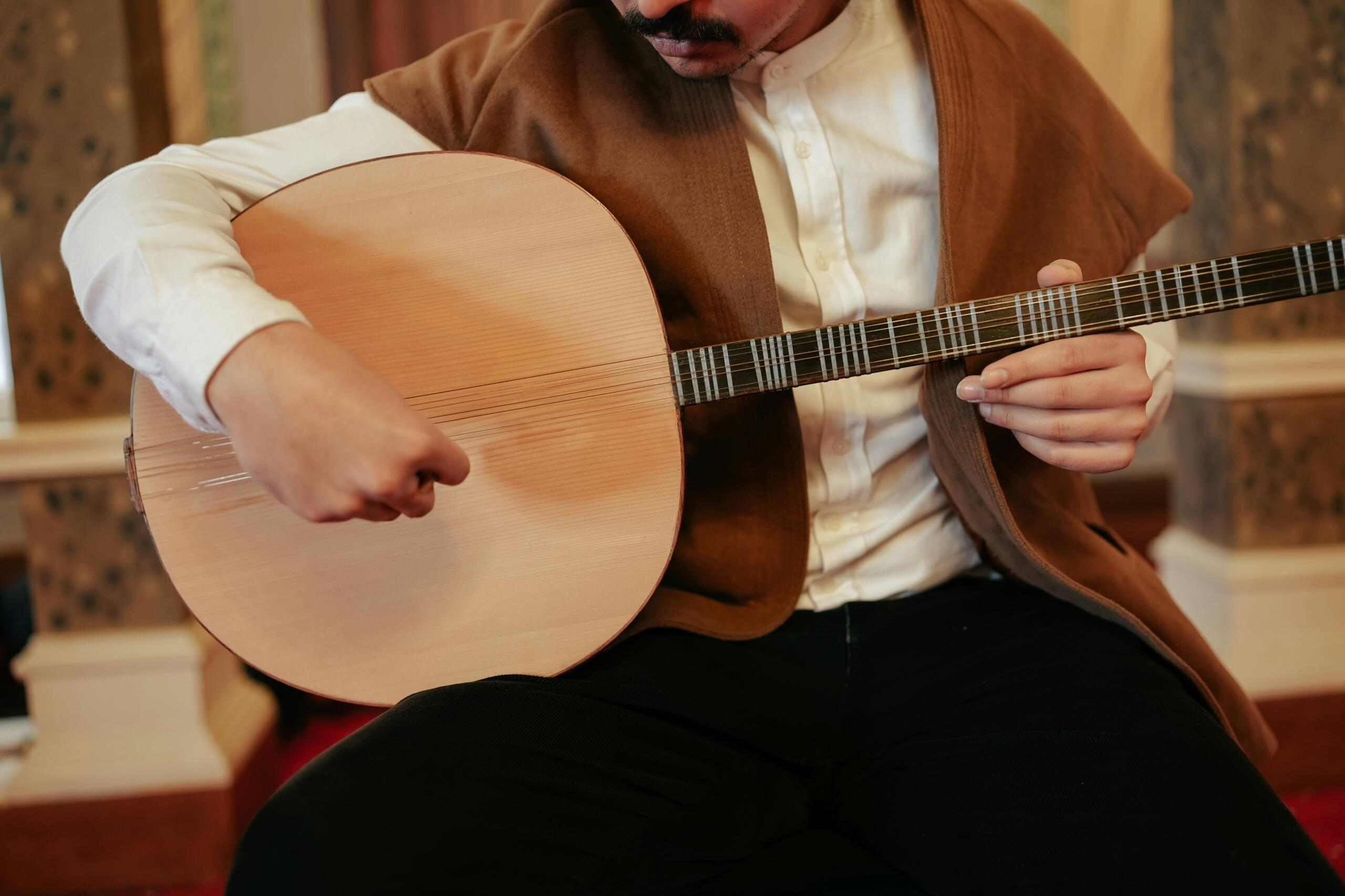 A man playing the cittern.