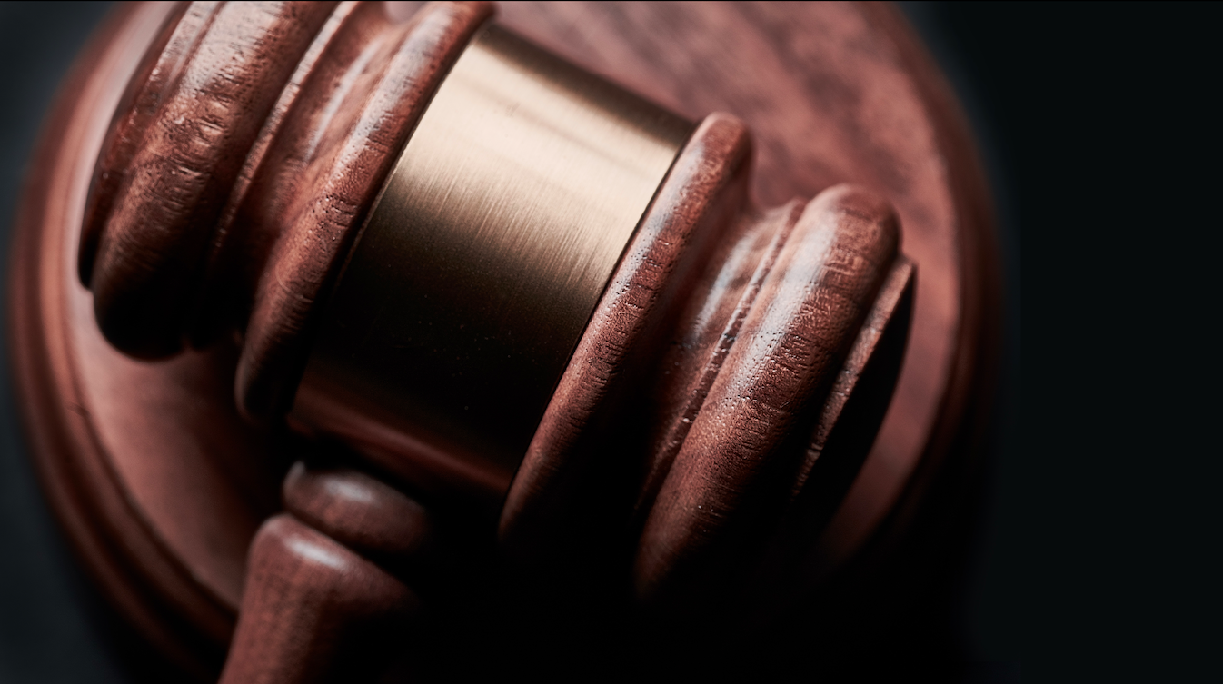 Closeup shot of a brown wooden gavel.