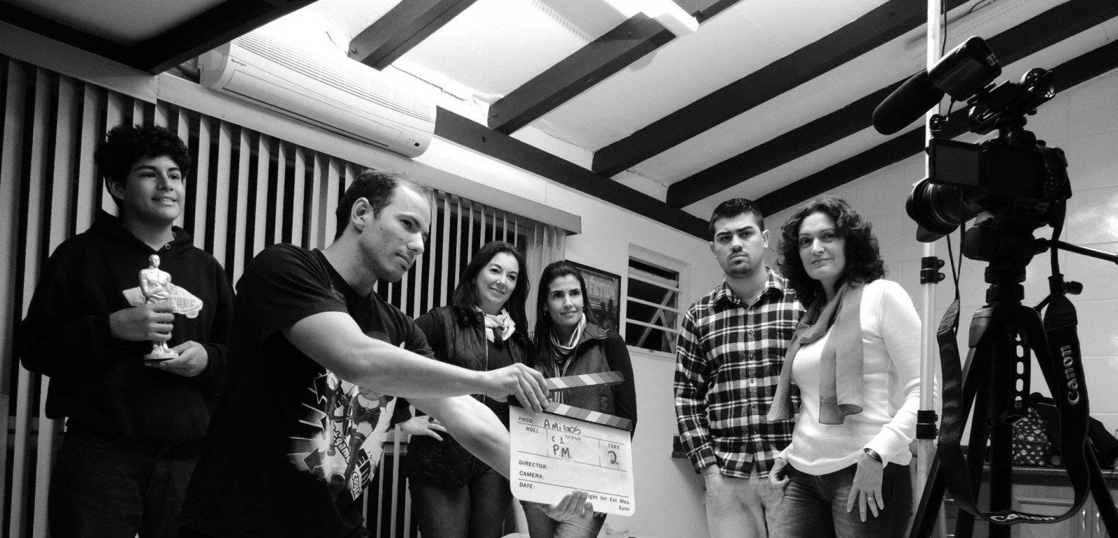 Group of acting students practicing on camera reading