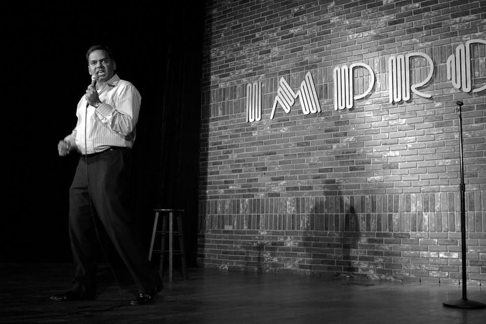 a live improv show by a guy on stage
