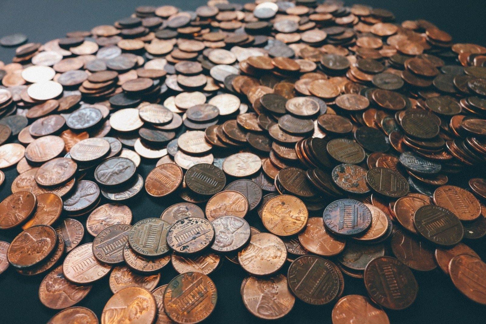 thousands of pennies laid out on a table