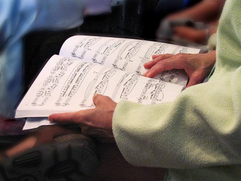 A student reads sheet music.