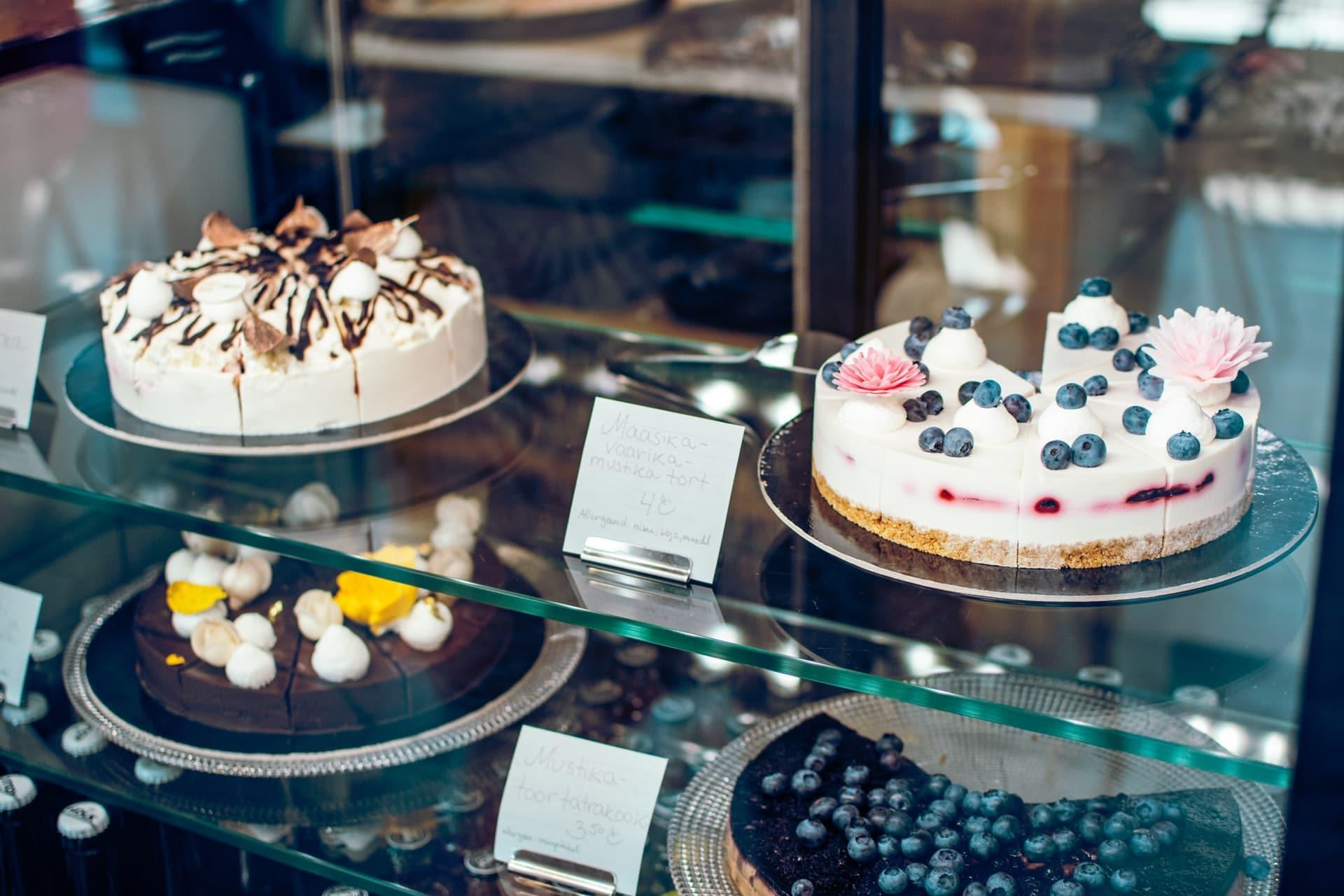 Stakes of cakes on a glass display