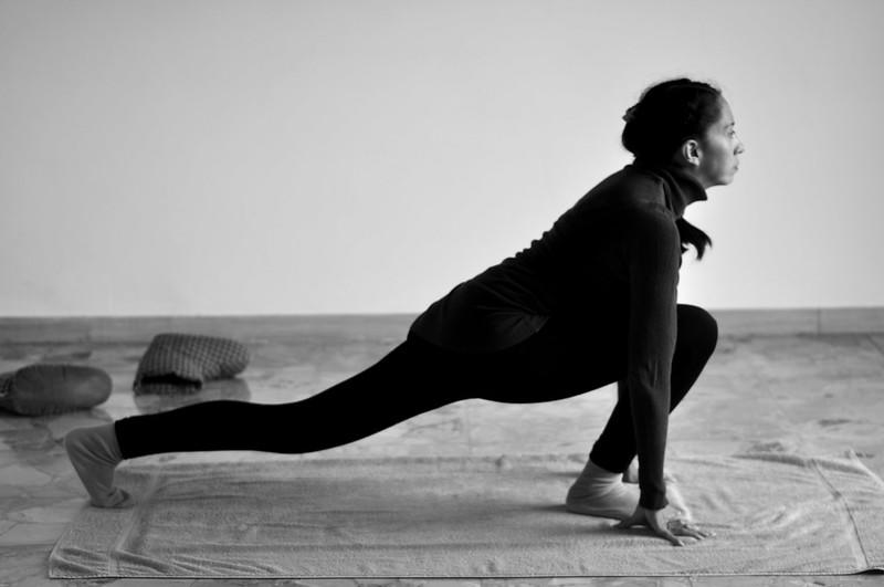 A female student performs a pose. 