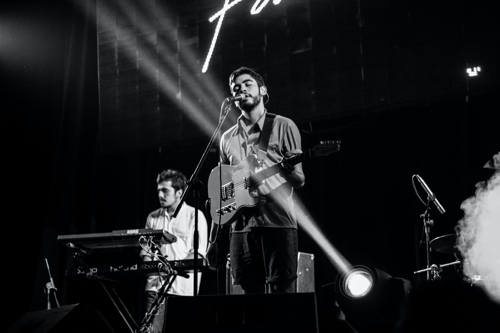 performing with a guitar