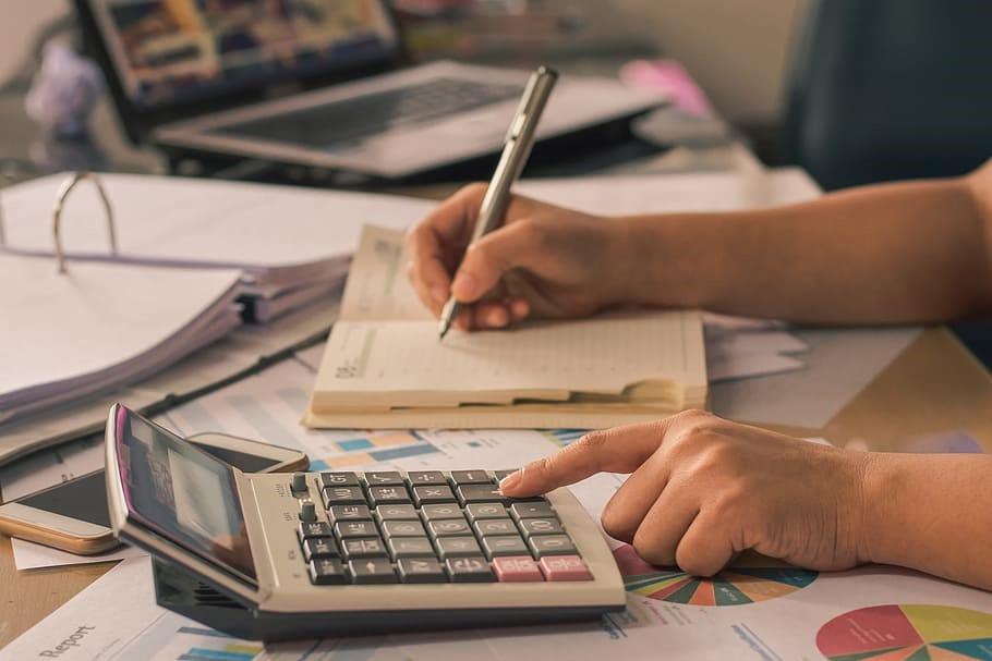 A student calculating and making notes