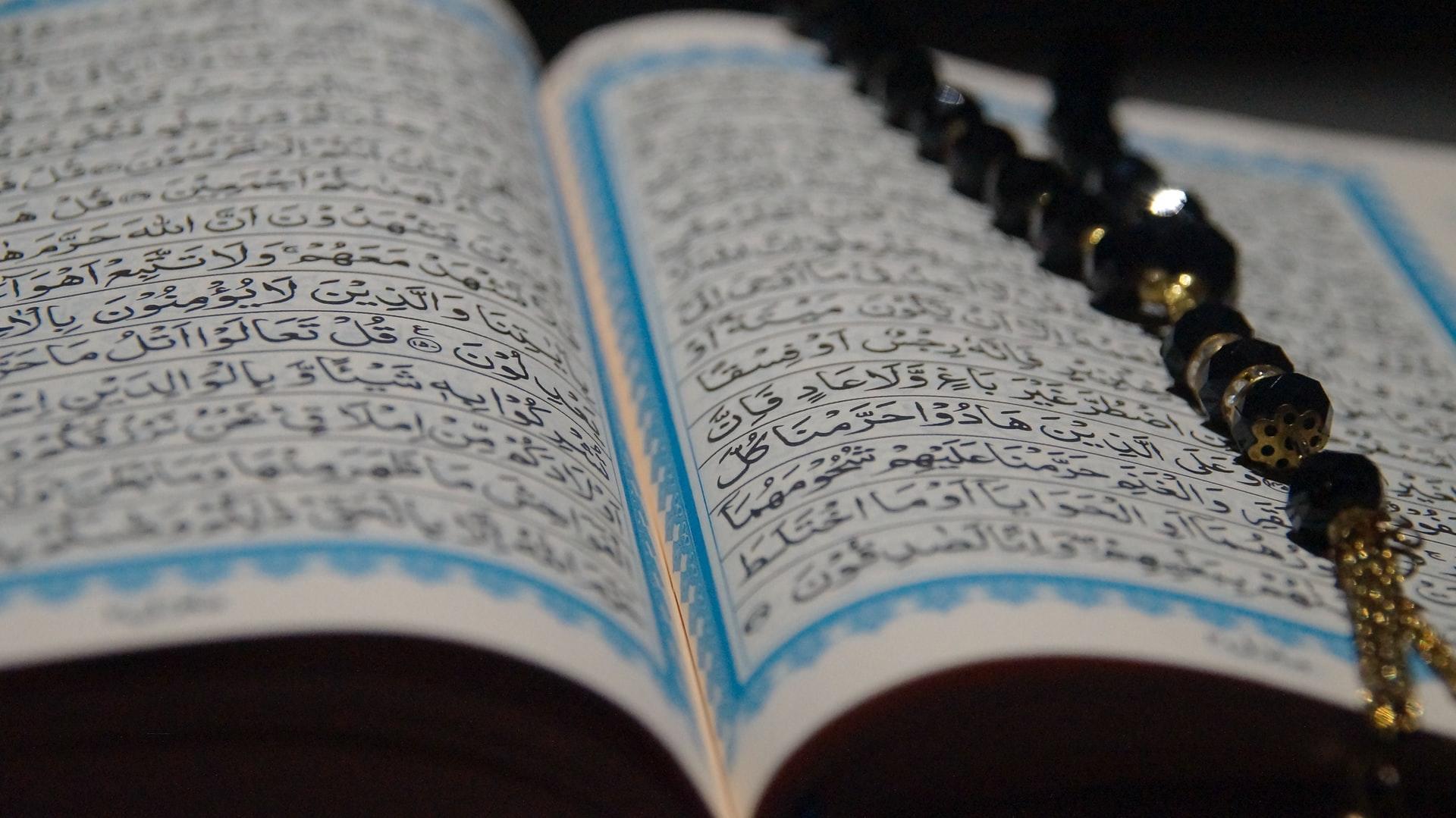 a closeup of an open book with writing in Arabic