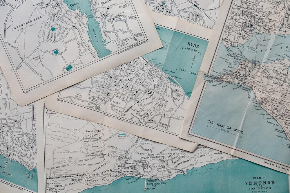 Multiple maps lined on top of each other. When traveling – either by road, sea, or plane – you will be heavily dependant on mathematics. Finding a math tutor will tune your arithmetic skill to the point where you will be able to streamline your costs, save money and predict how much you will need on a trip