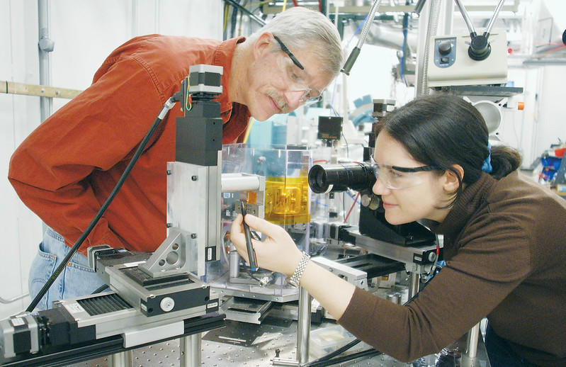 A teacher & student conducting research