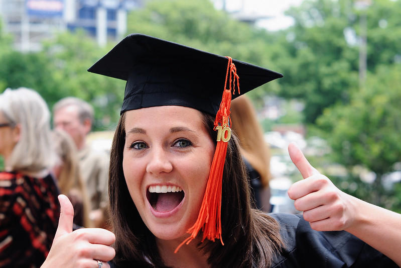 A student celerbates on the day of graduation.