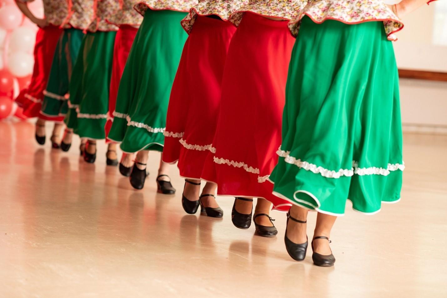 Russian women learning cultural dances. By learning Russian, you can immerse yourself in the Barynya dance performance, performed to a traditional Russian poem called Chastushka.