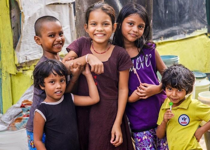 Indian children smile as they pose for a picture. Many schoolchildren in India learn two languages—Hindi and their state language. State languages include Tamil for Tamil Nadu, Assamese for Assam, and Konkani for Goa. Taking Hindi classes will arm you to communicate in any state in India!
