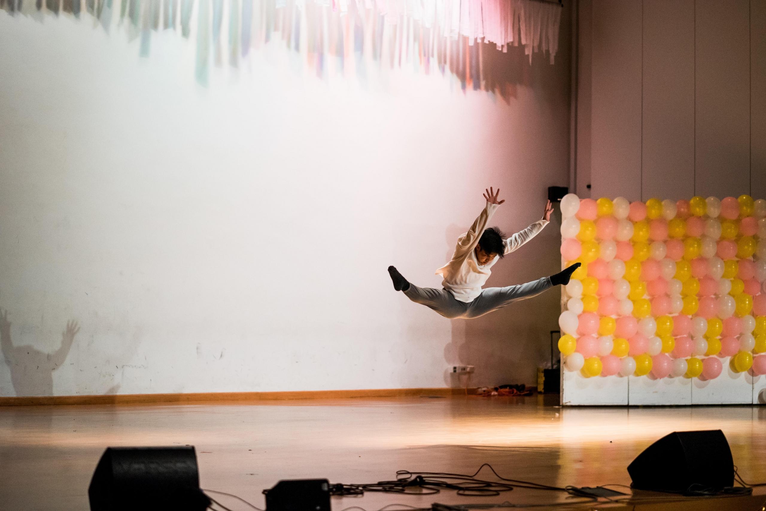 A dancer performing in a competition by using tips and tricks acquired in hip hop dance classes.