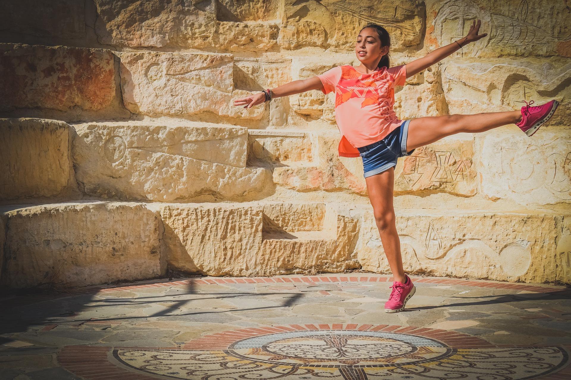 A teenage girl practicing what was taught in her hip hop Oakland classes in her private space.