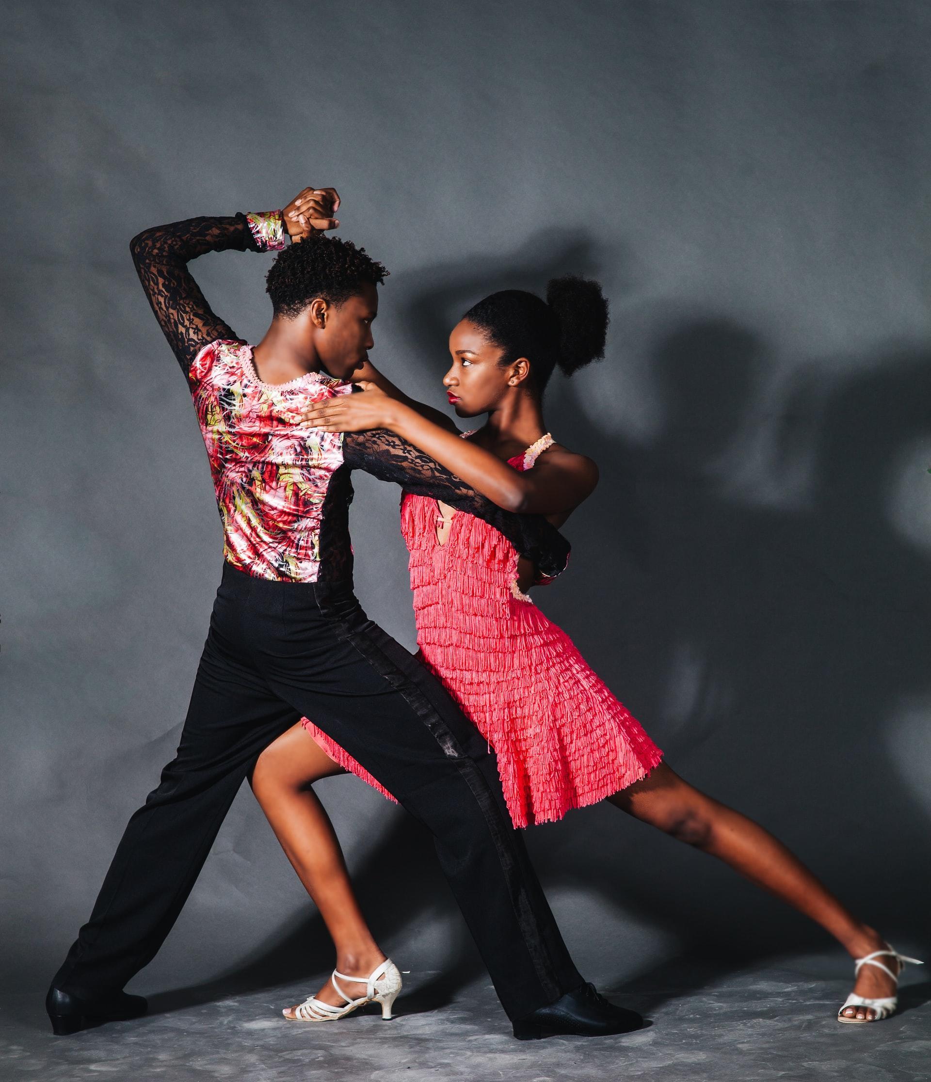 dancers pose for a photo in salsa