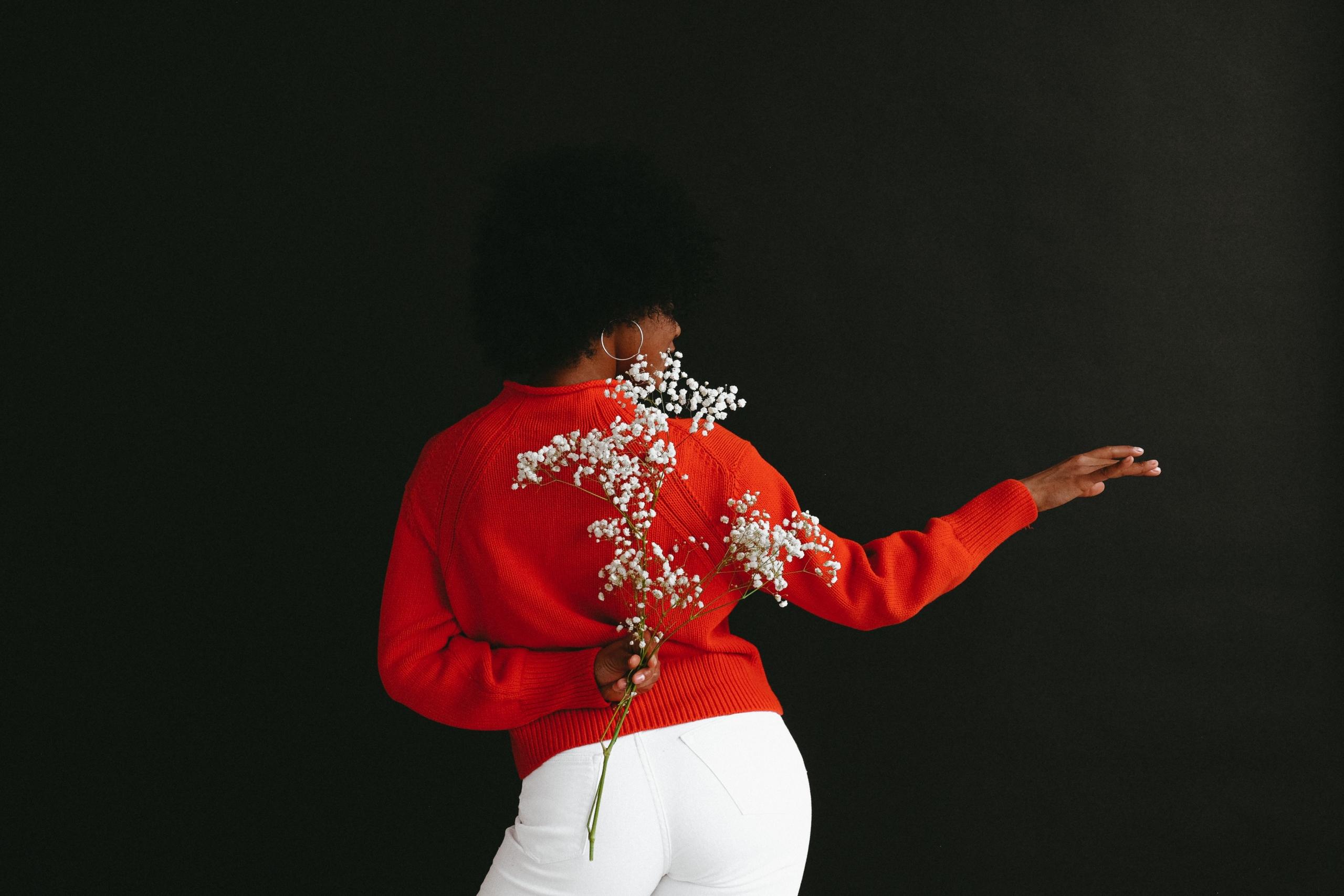 red colored sweater girl dancing by herself