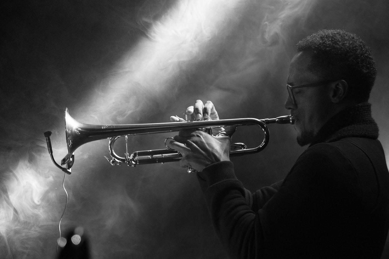 black and white photos of guy playing trumpet
