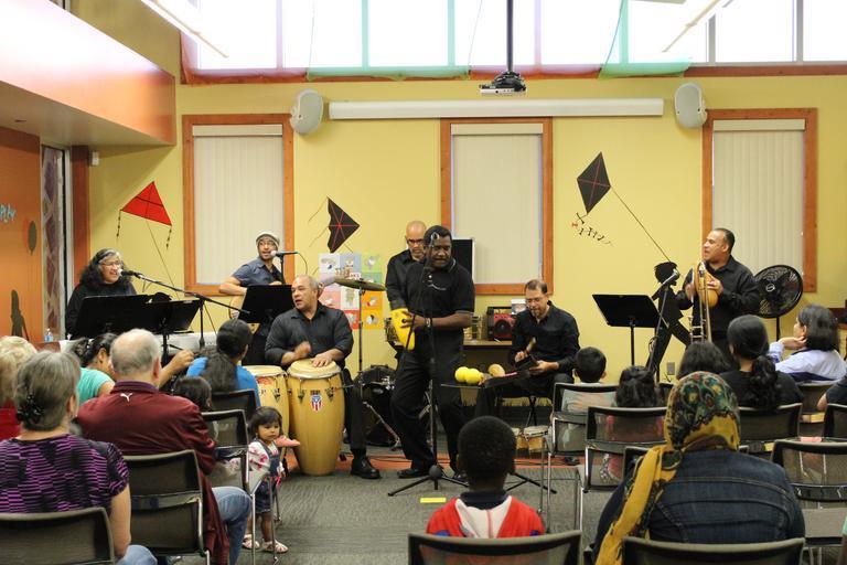 Band of musicians play to crowd
