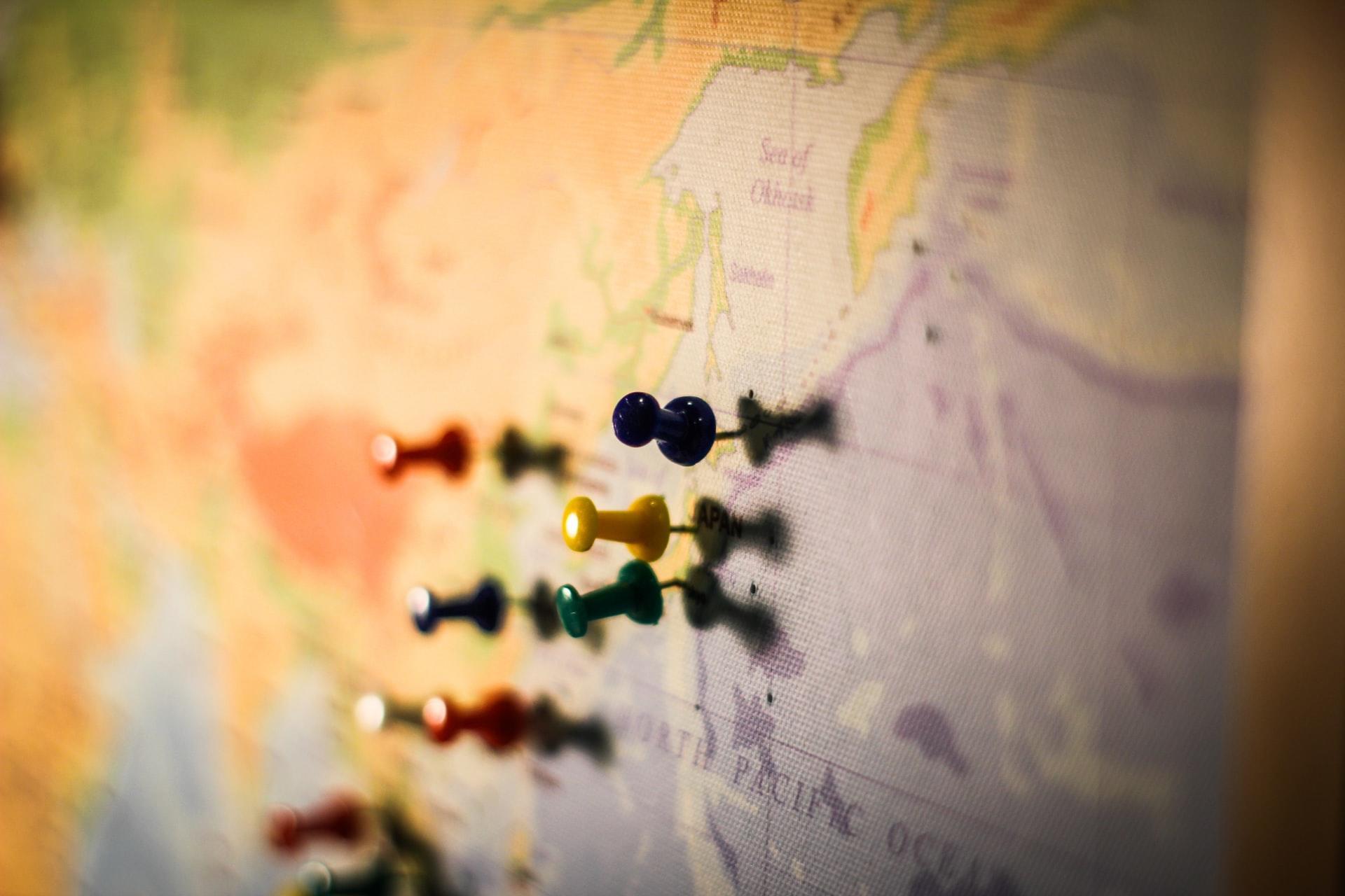 A map poster with pins in it