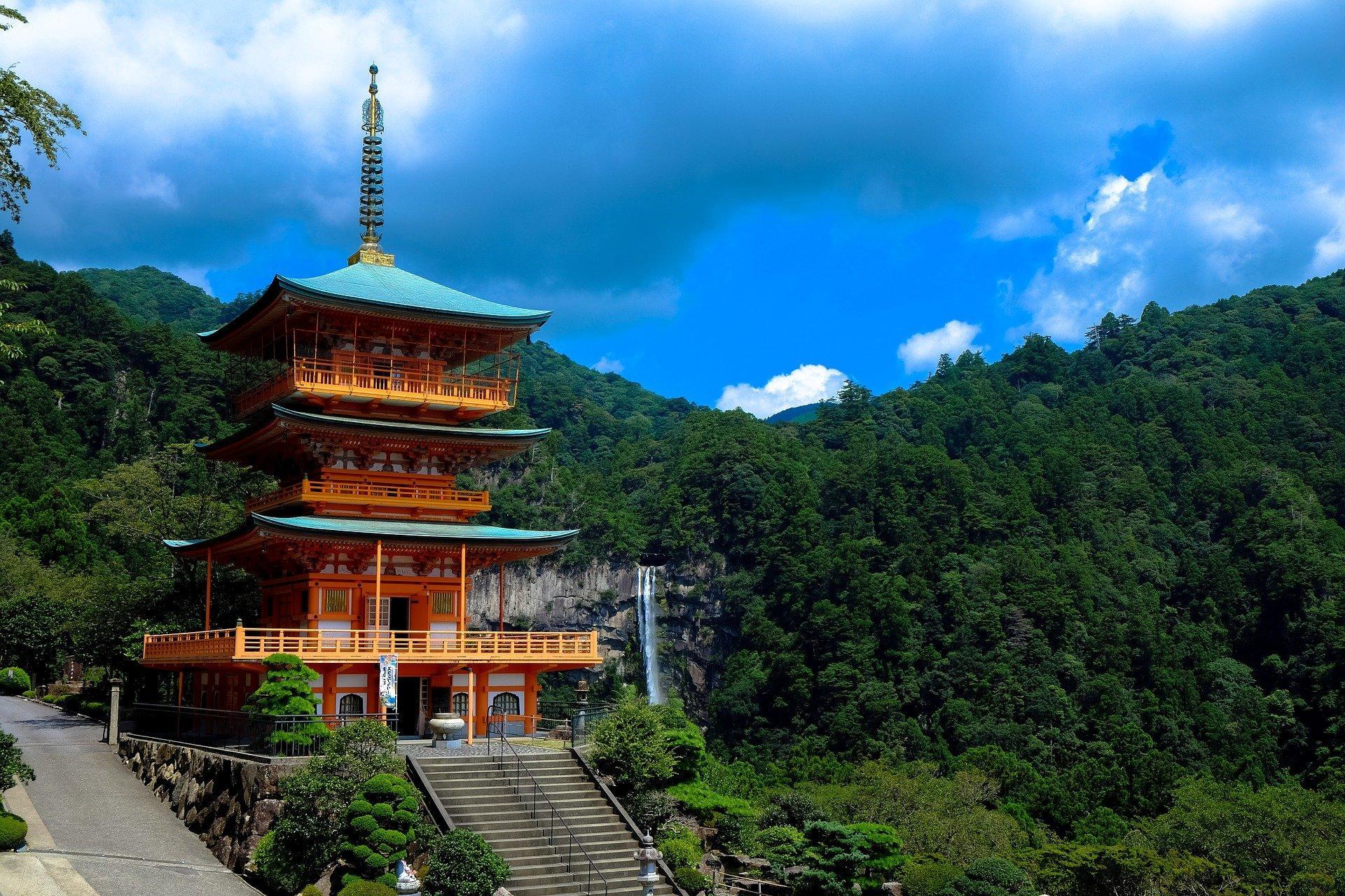 A Shinto temple in the mountains in front of a scenic backdrop. Japanese mythology dictates that the creation of all that we see on Earth is the result of Izanami and Izanagi's Jeweled spear