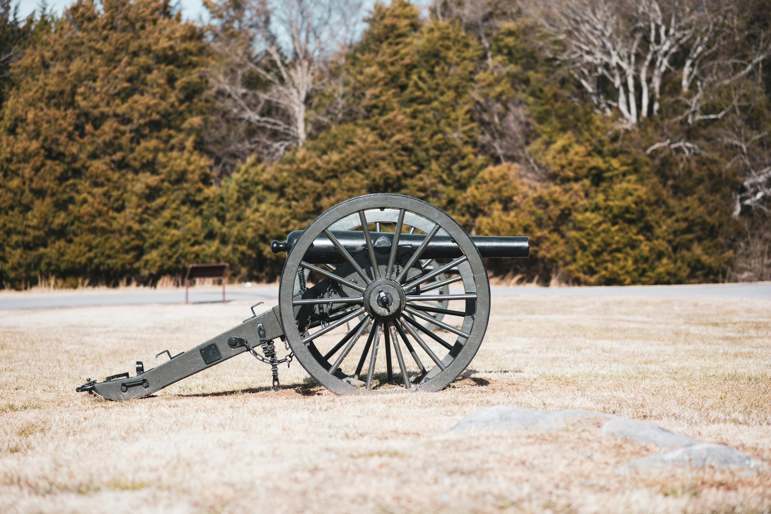 A cannon prepared to fire on the battlefield
