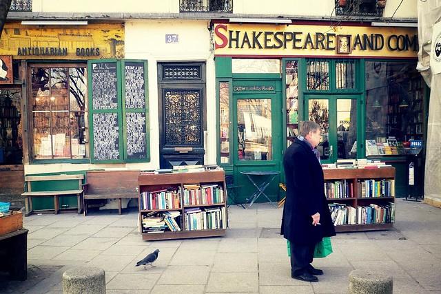 Man standing in front of the Shakespeare and Company bookstore. William Shakespeare is a household name because of his plays, poetry, and overall literary excellence; however, the world of literature owes gratitude to many other people that deserve the same respect