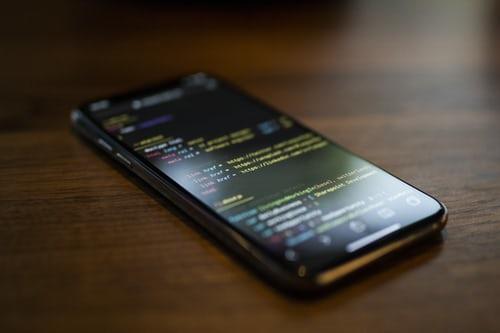 A smartphone running a code. Computer programming teaches us how to code and create using specific programming languages; some of these languages may be exceedingly difficult to learn and understand