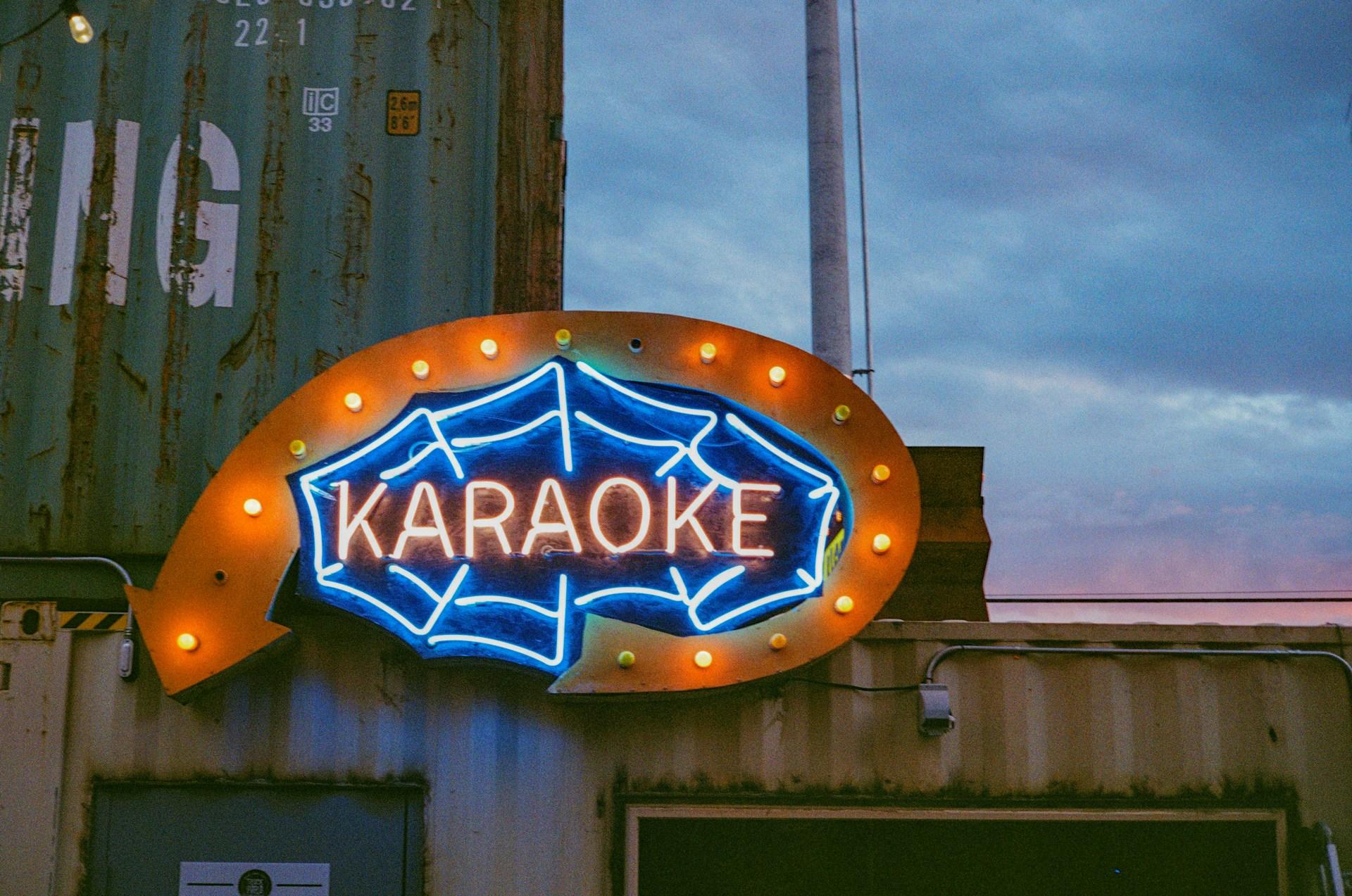 A neon sign to a karaoke bar.