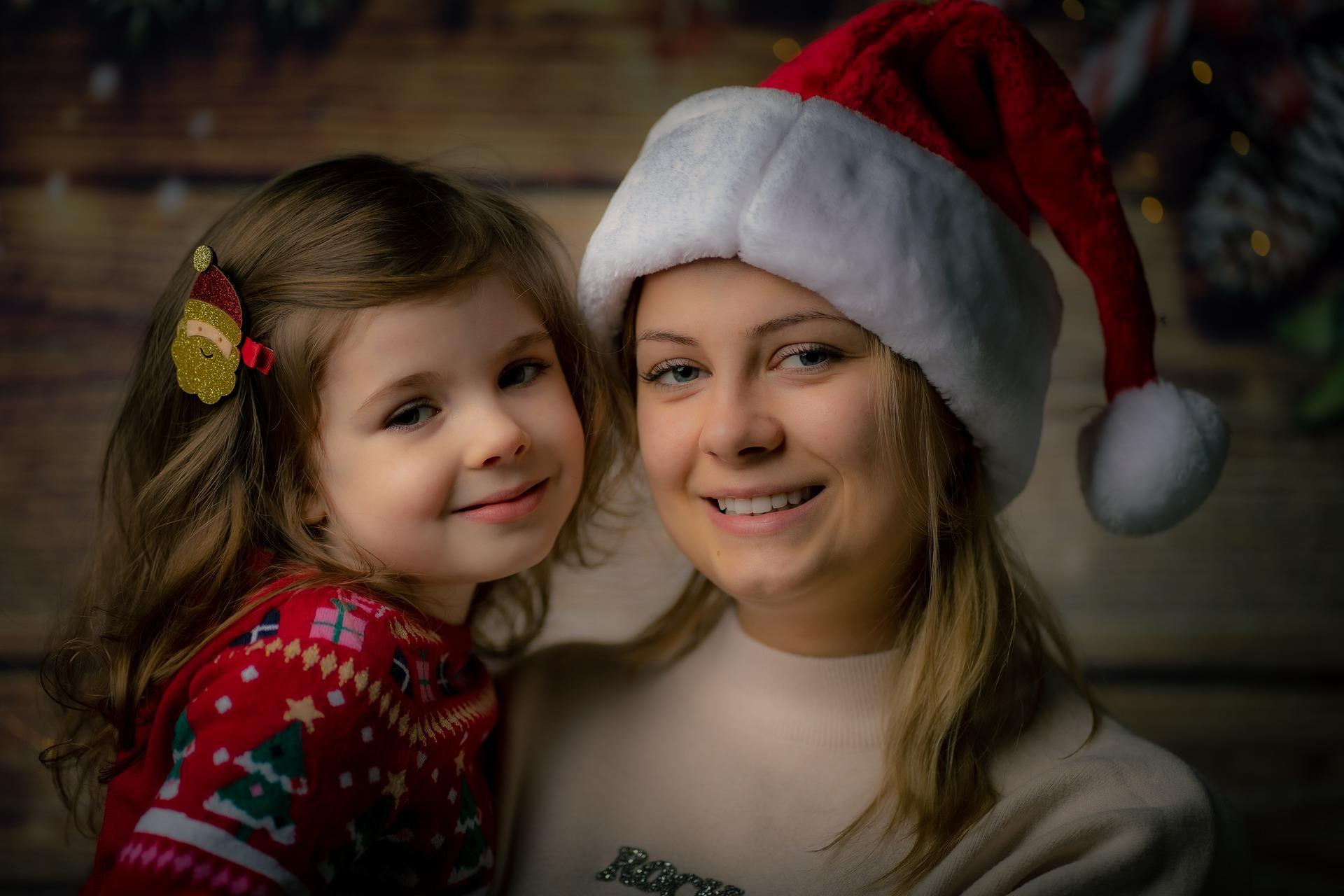 A mother and daughter pose happily for a picture. Babysitting helps parents – especially mothers – remain calm and satisfied while they are working. Sitters make sure the child is protected and well-fed